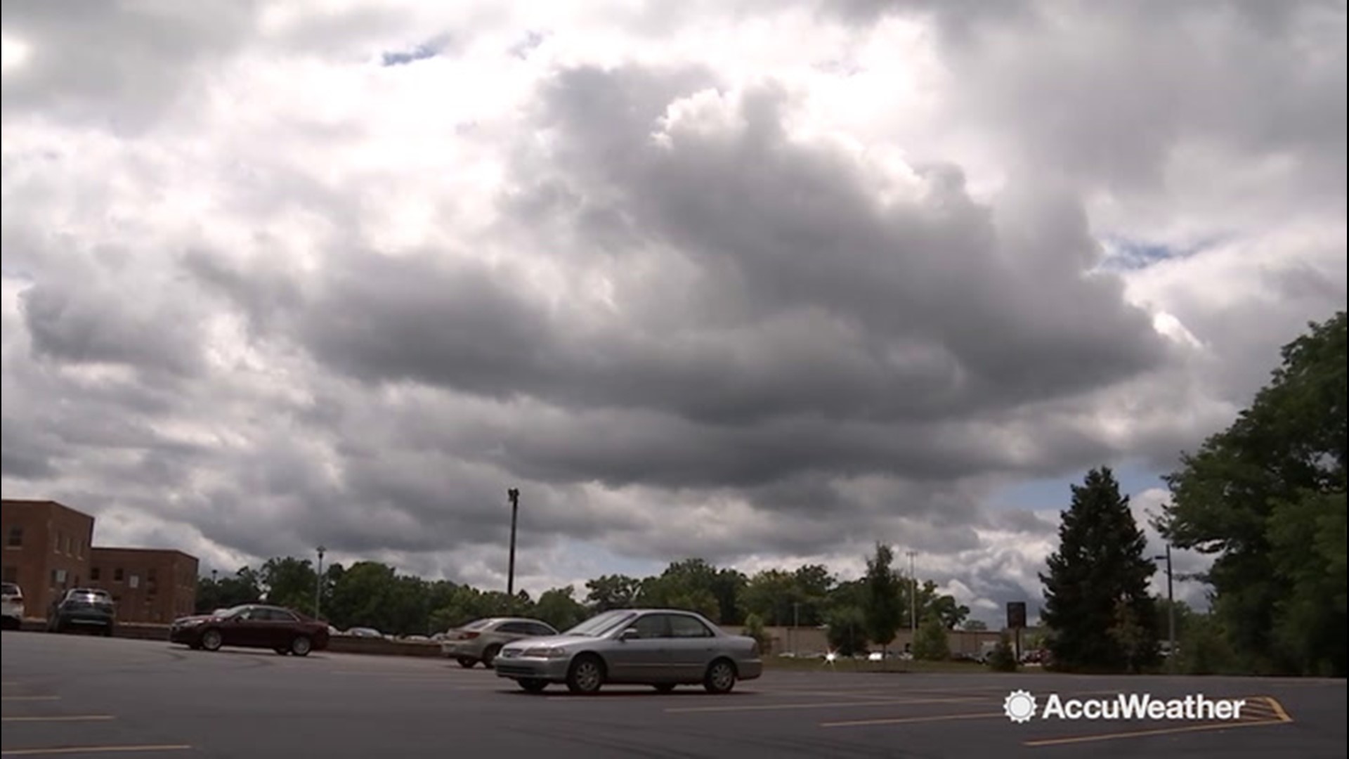 A collection of cumulus clouds with peaks of sunshine spread throughout the sky in Kalamazoo, Michigan, in and around the Western Michigan University campus on August 6.