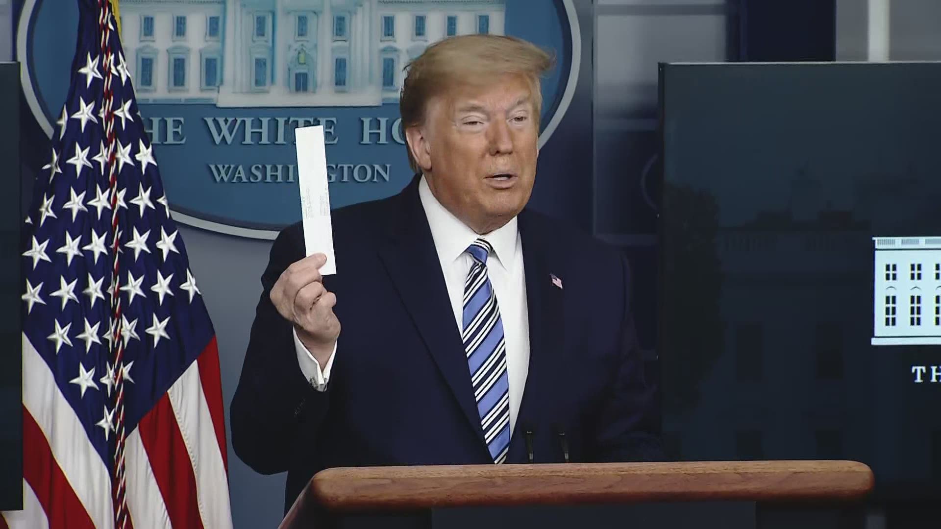 Taking it from his coat pocket, President Trump on Sunday displayed the swab used for coronavirus testing.
