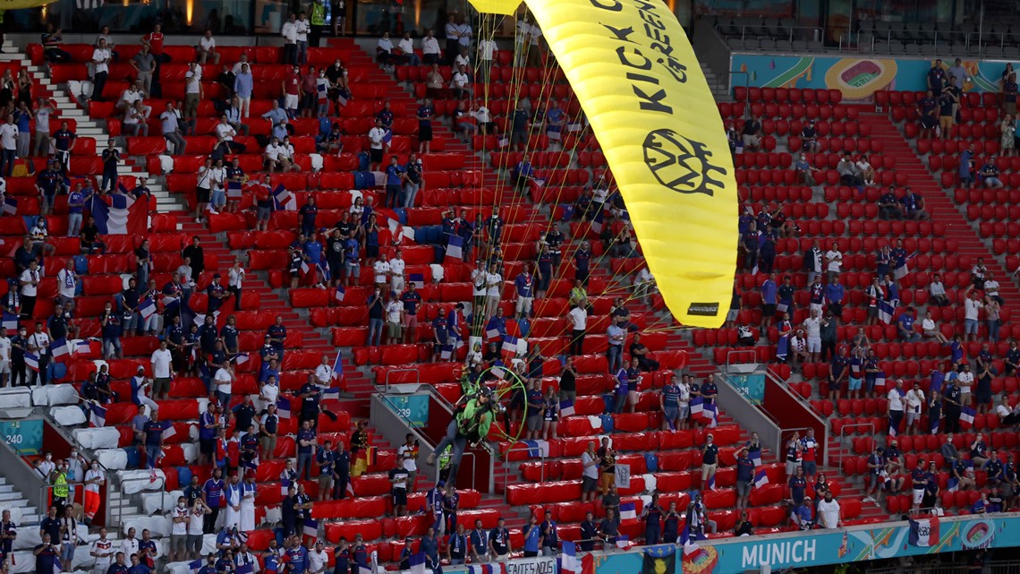 Euro 2020: Greenpeace protestor parachutes into stadium ...