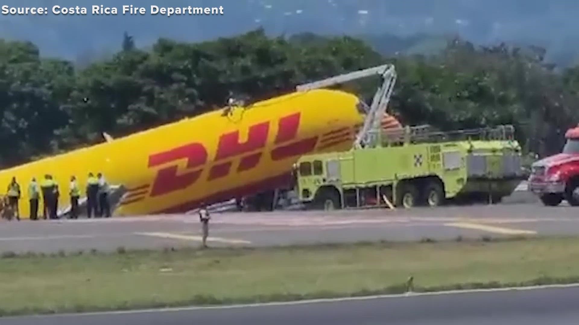 A DHL cargo plane reporting hydraulic problems skidded off a runway in Costa Rica Thursday and broke in two. The two-person crew is reportedly OK.