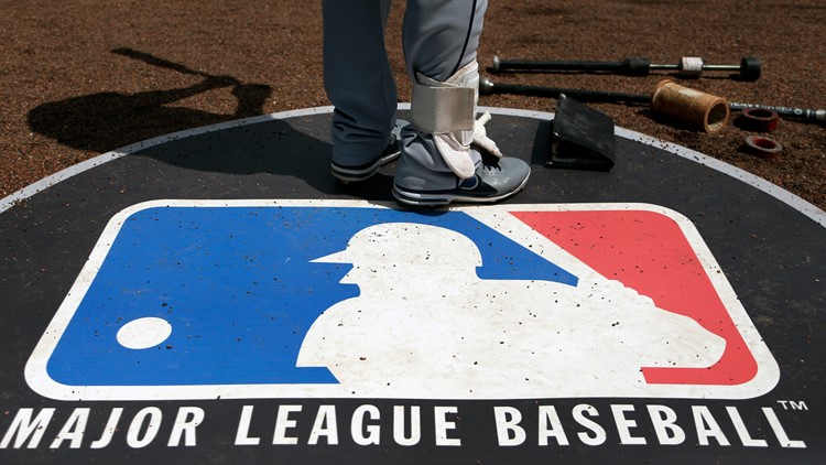MLB players vote to end lockout, salvaging 162-game season