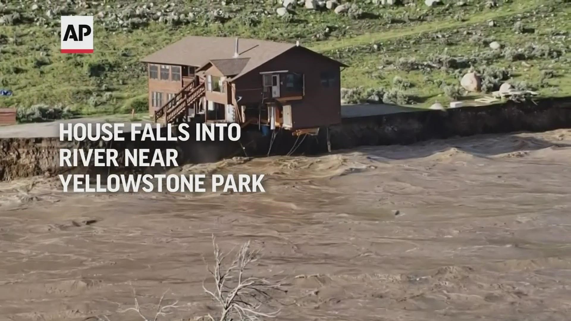 On Monday evening, rushing waters undercut a riverbank, causing a house to fall into the Yellowstone River and float away mostly intact.