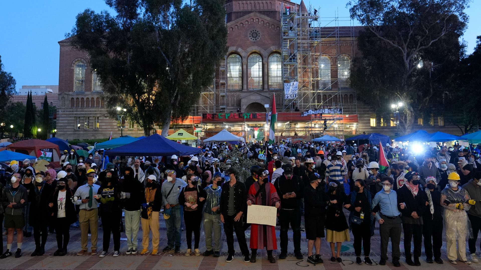 Police moved on the UCLA encampment early Thursday, tearing down barriers and using flash bangs as they advanced in the protesters.
