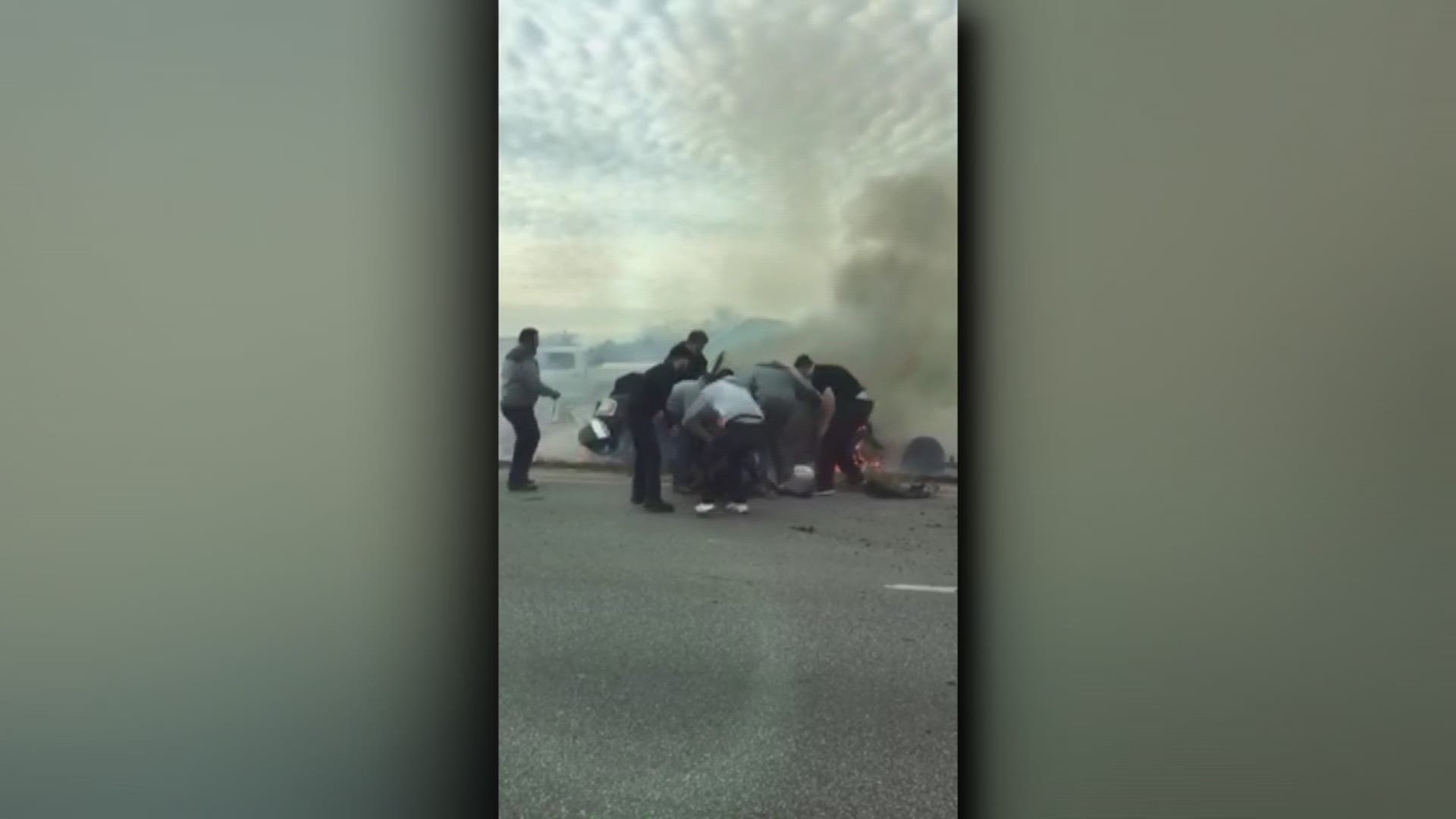 Heroes save man from burning car