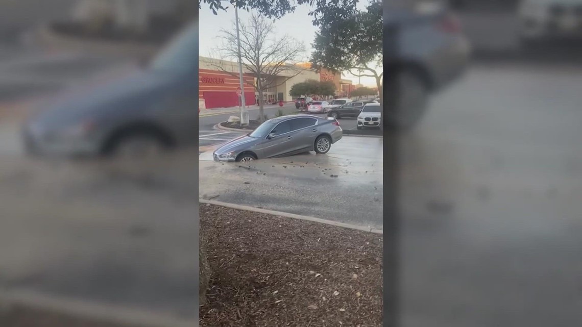 Driver winds up stuck in a hole after pavement collapses in parking lot - Vimarsana News