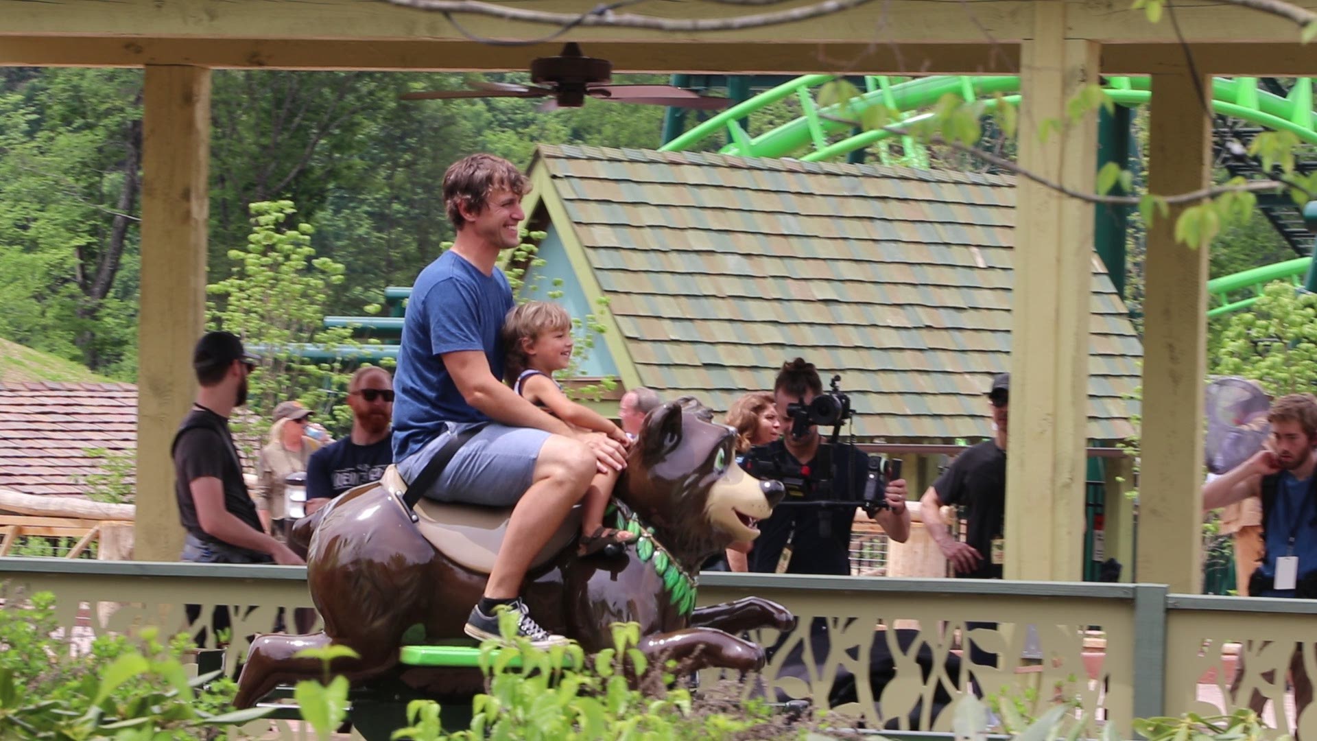 Parents and children enjoy Black Bear Trail, one of 'Wildwood Grove's cool rides.