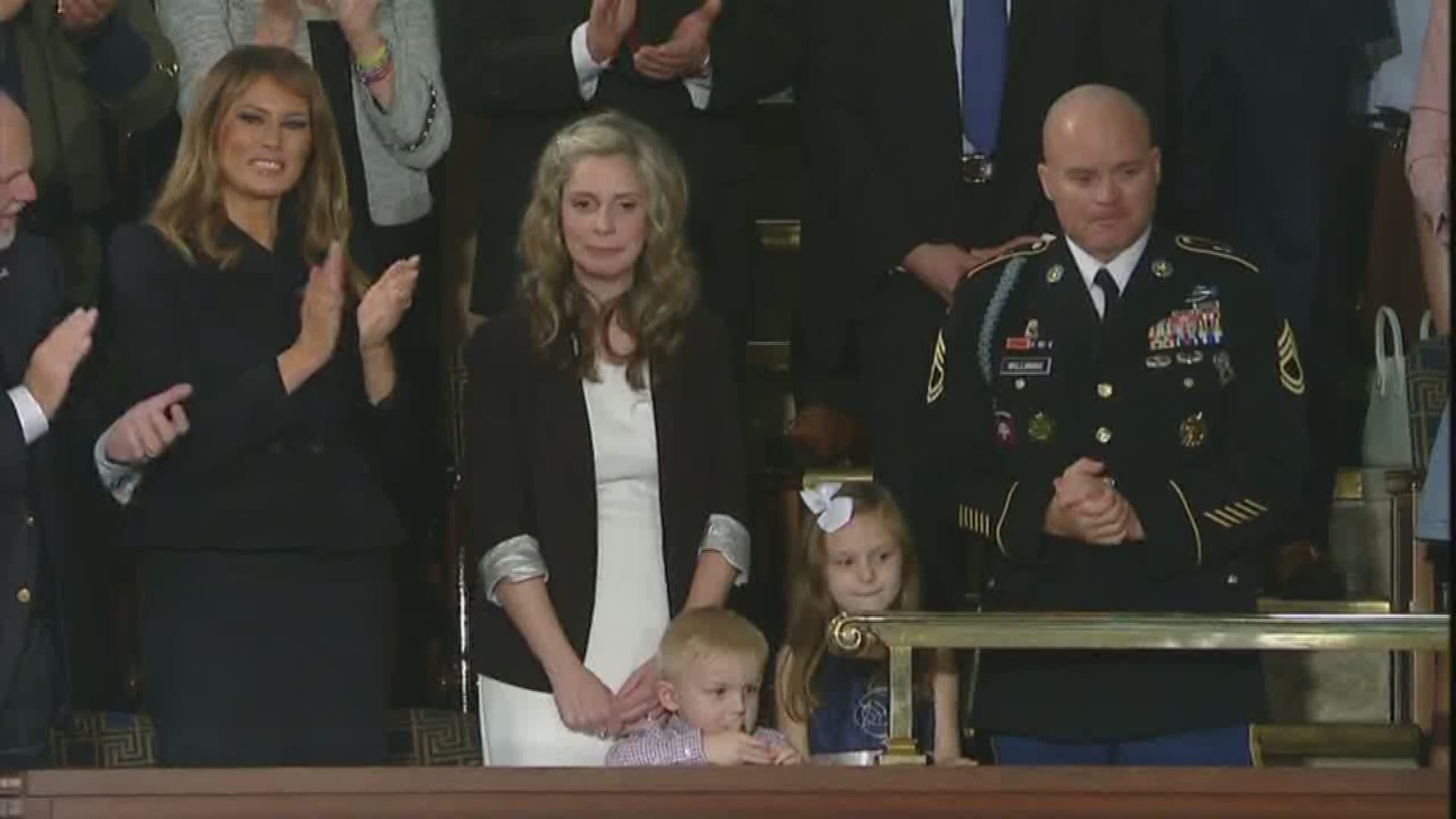 A family was reunited with their husband and father in a surprise emotional display during the president's speech Tuesday night.