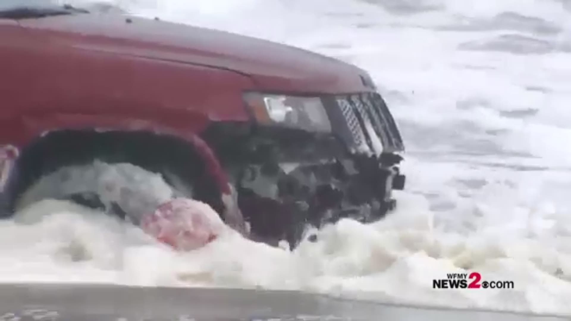 The mysterious look that has captivated hundreds across social media--why is there an SUV on Myrtle Beach? The SUV is taking quite a beating from high tide and surf, created by Hurricane Dorian.