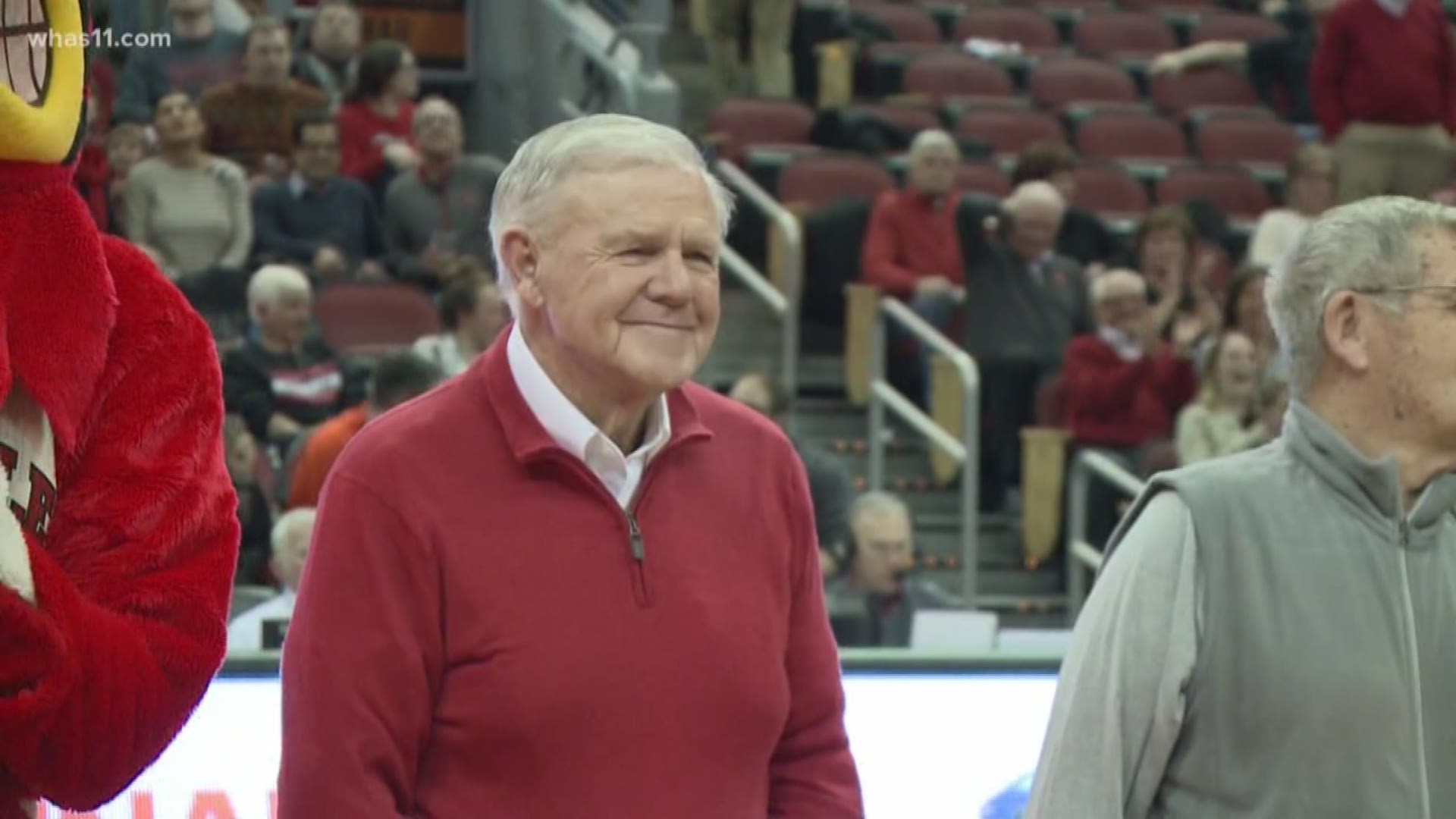 Former U of L coach Denny Crum shows off his sports collection