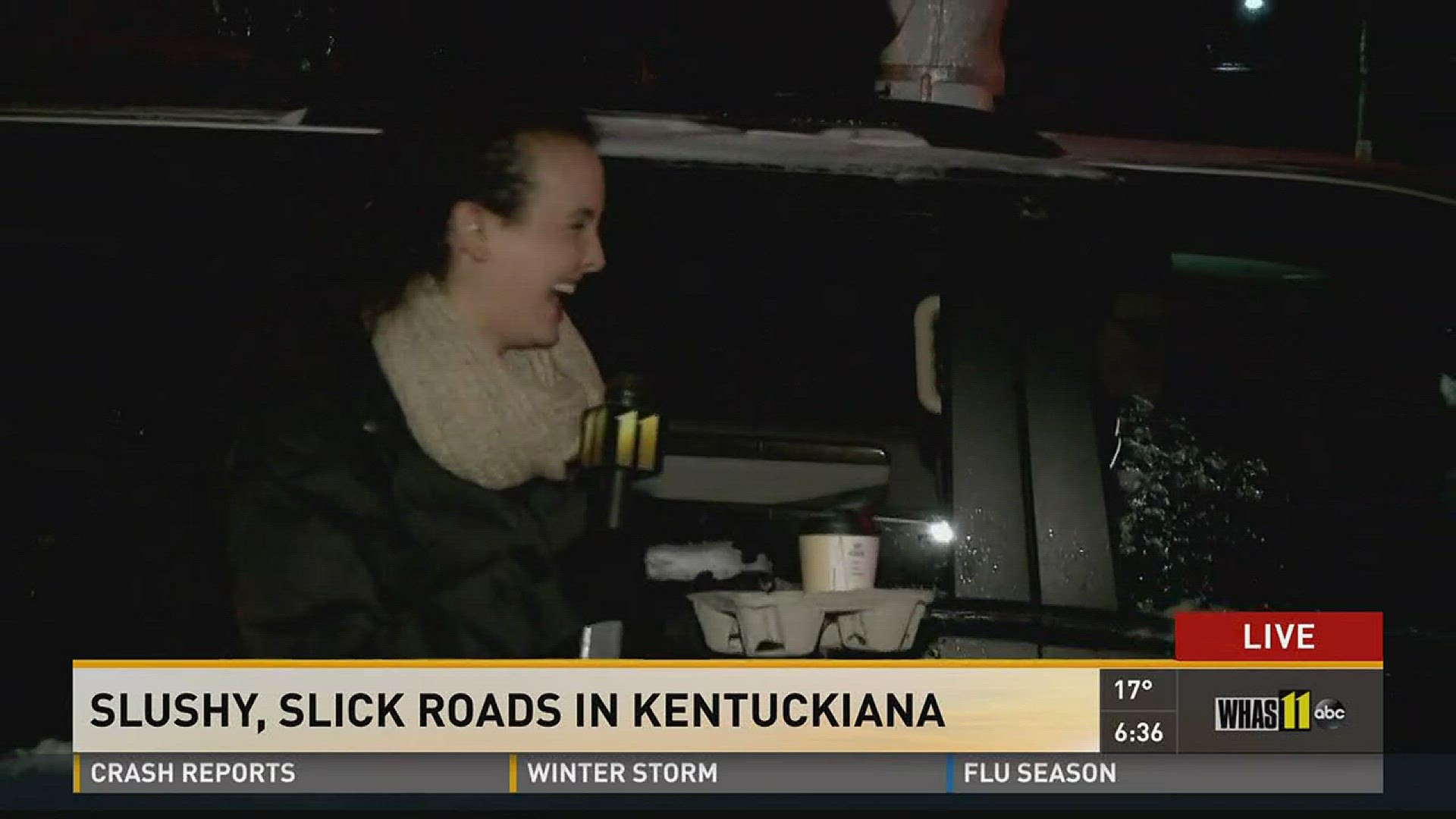 Meteorologist Reed Yadon brings coffee to freezing GMK reporter Sara Wagner as she reports on road conditions after a big snow in Louisville, Ky.