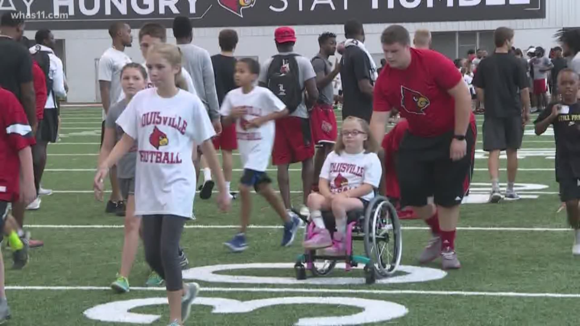 The event gives children who have experienced cancer or other illnesses an opportunity to participate in a skills camp with UofL football players and coaches.