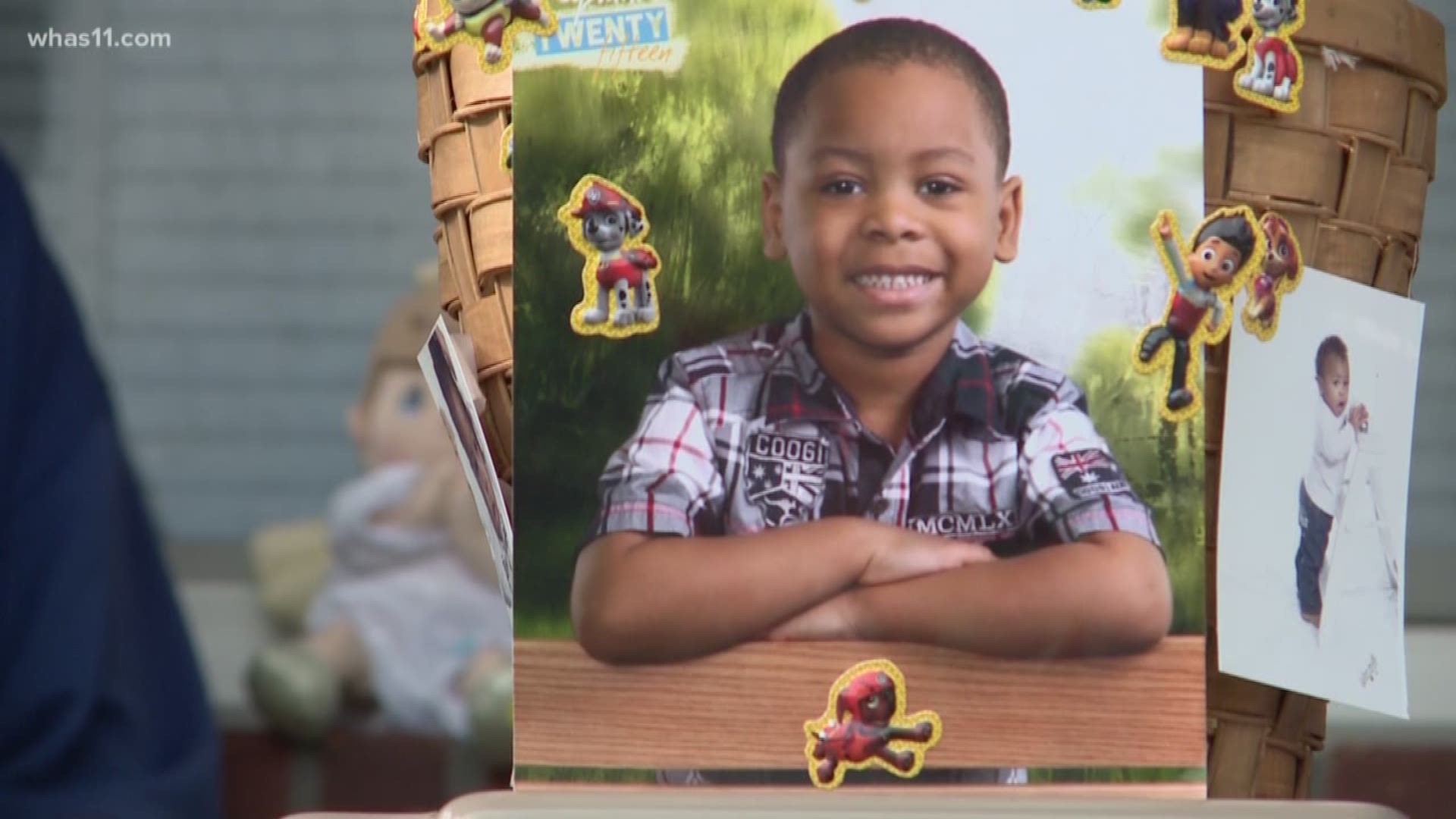 The 7-year-old was killed by a stray bullet that struck him while he sat at his kitchen table.