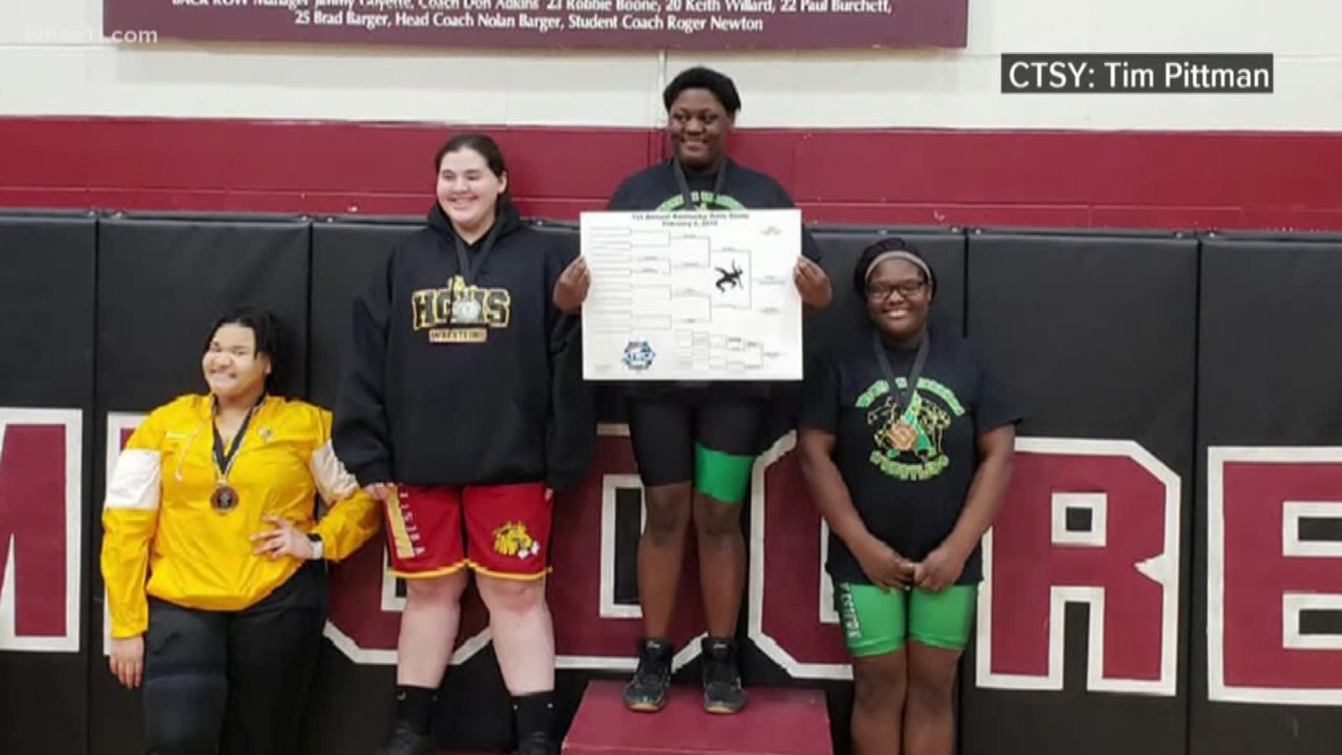 Malasha Lokey had never competed in wrestling before this school year. Now, she's a champion.