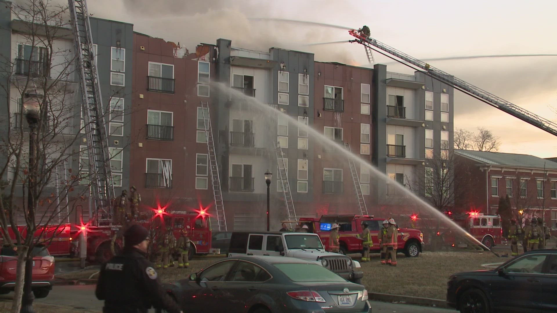 No injuries reported after nearly 100 firefighters battle three alarm apartment fire in Louisville