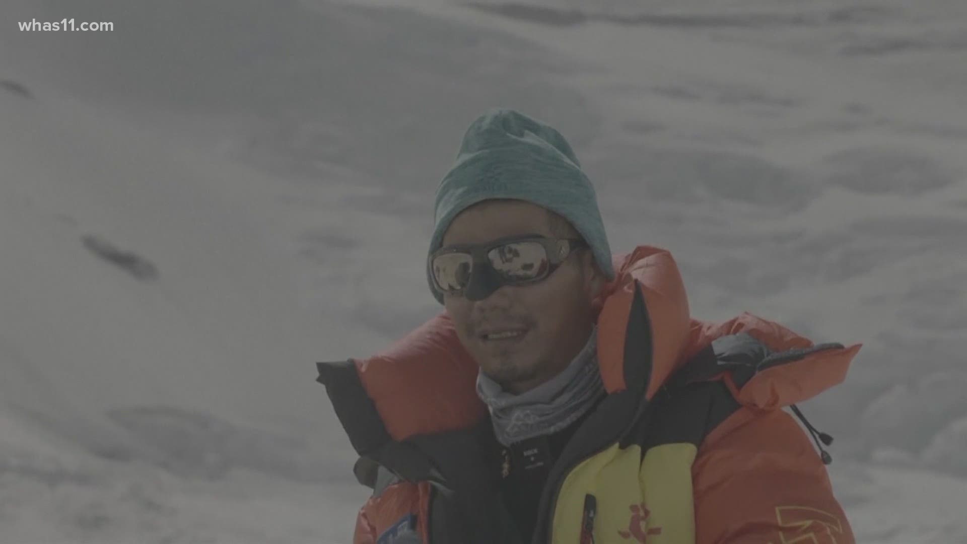 Zhang Hong, 44, is also the third blind climber internationally to reach the world's highest peak.