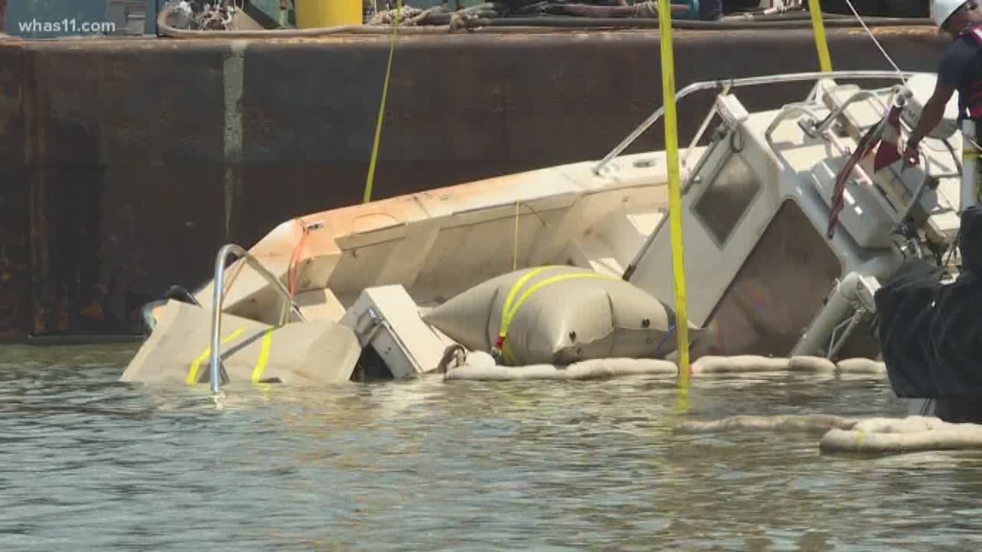 Days after severe weather caused the boat to sink, it was pulled from the river.