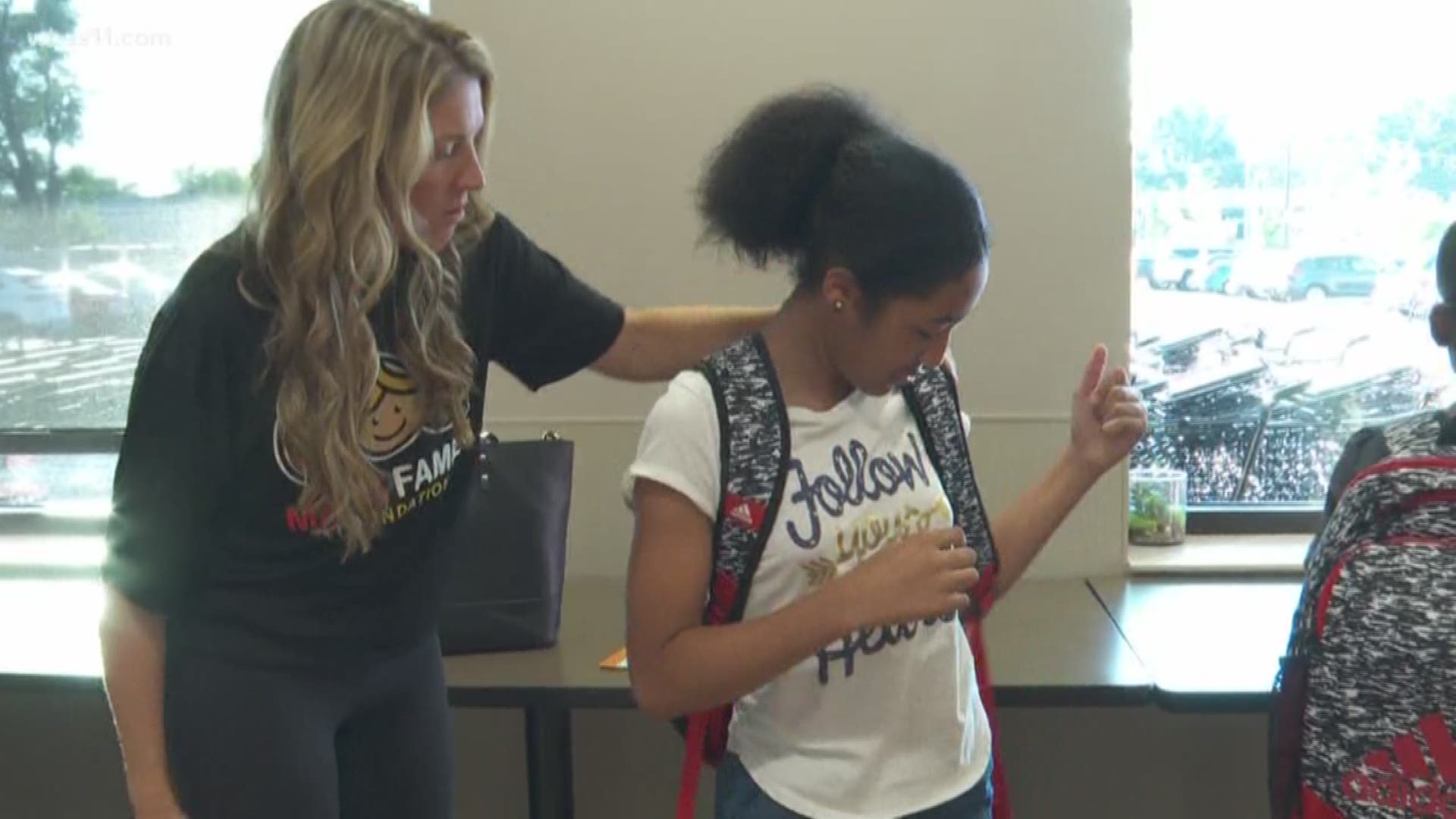 One hundred children and their families got a back to school surprise as volunteers handed them brand new backpacks loaded with school supplies for the upcoming school year.