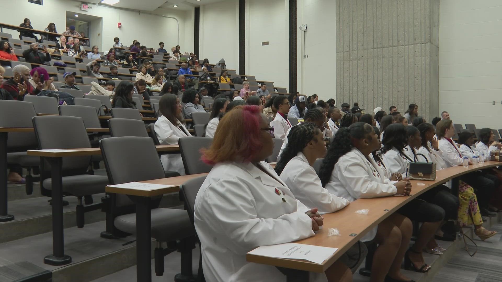 The students in the pre-medical program were given white coats during a Sunday ceremony reminding them of goals that can be fulfilled.