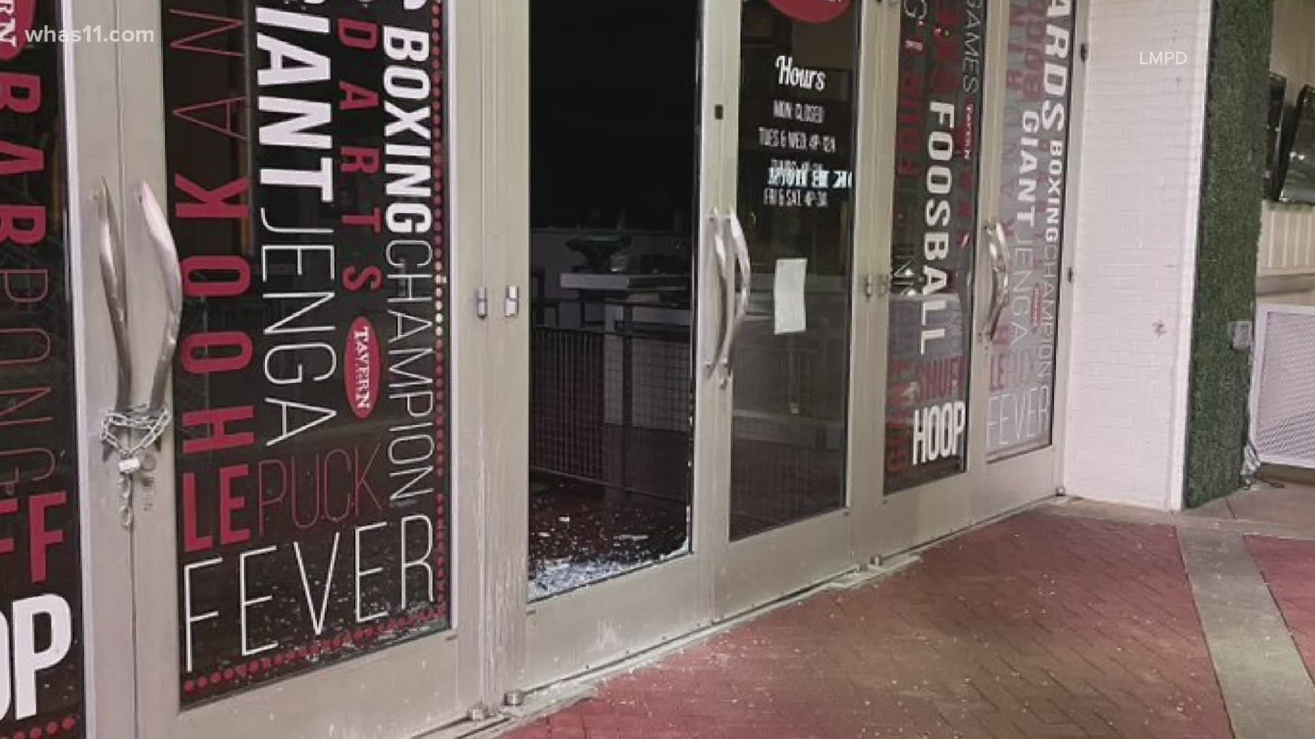 LMPD posted photos on their Facebook page showing windows posted out at several businesses around Fourth Street Live.