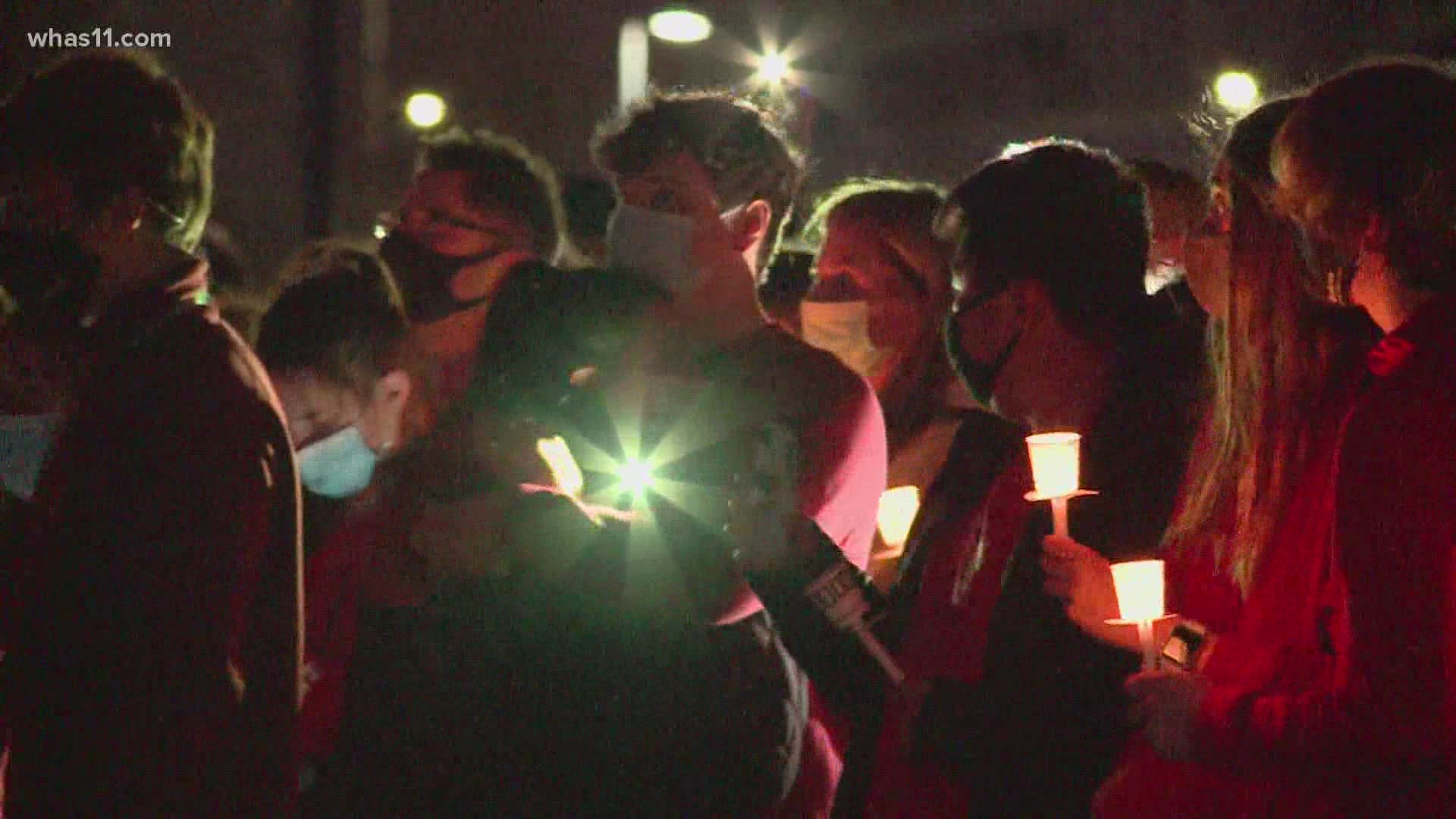The Big Four Bridge was lit red as friends and family gathered to remember a 16-year-old whose body was found nearly 2 months after he went missing while kayaking.