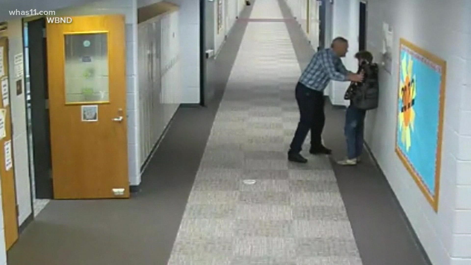 The Jimtown High School teacher was barred from school grounds for striking the student, which was caught on school security cameras.