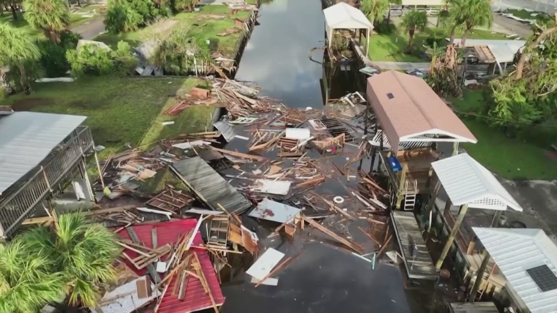 Residents pick through the rubble of lost homes and scattered belongings in  Hurricane Idalia's wake