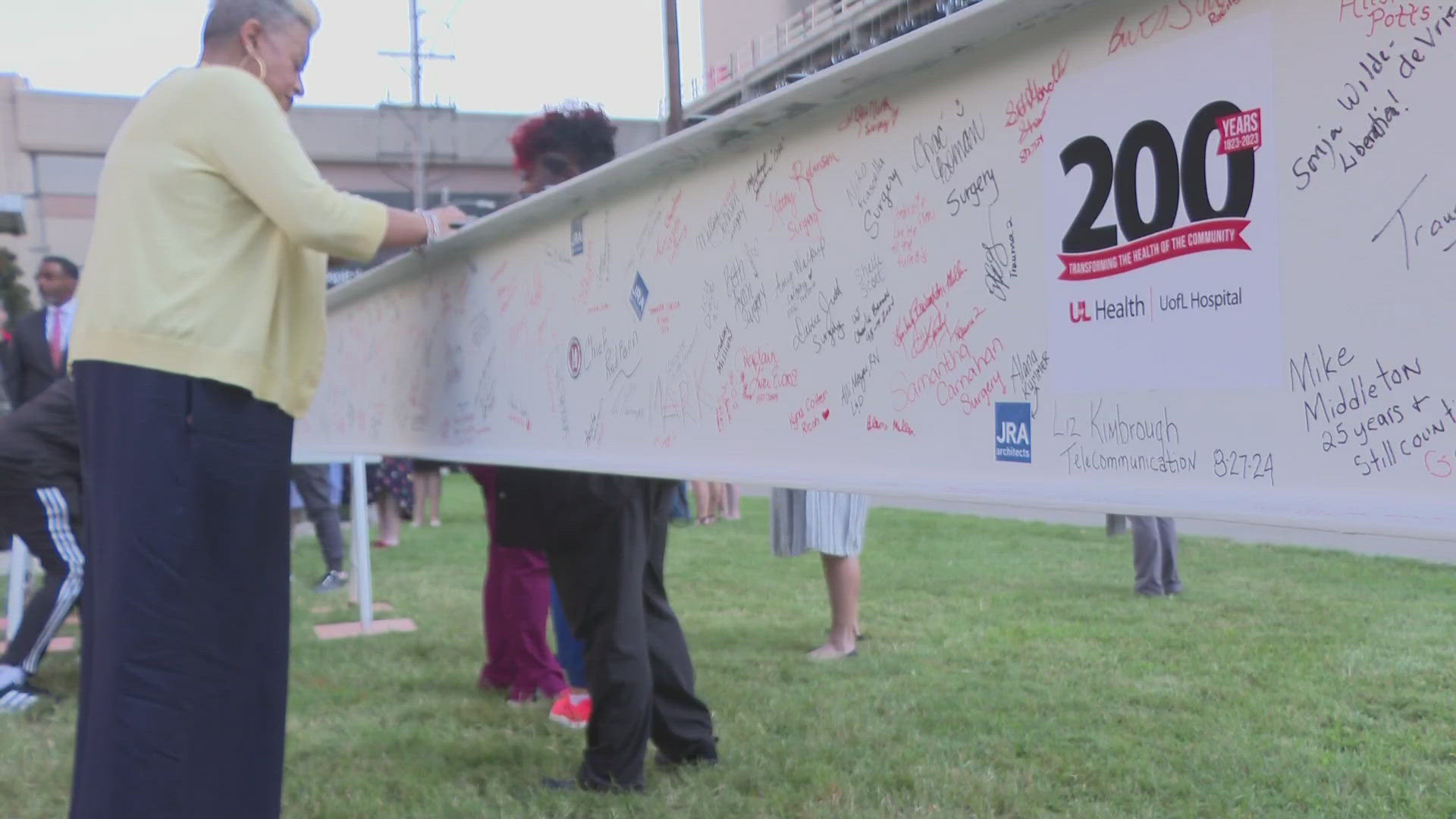 Wednesday, officials held a topping off ceremony for a 30-foot steel beam now taking its place in the structural framework of the new tower.