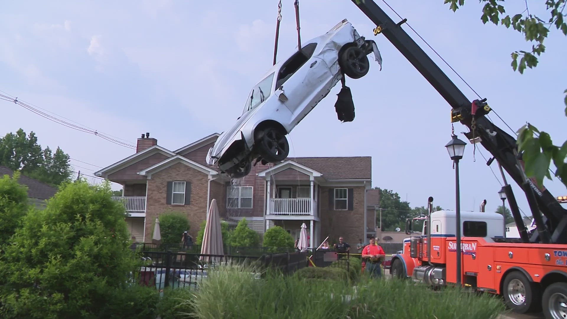 LMPD said the man was driving on Cooper Chapel Road on Tuesday when he was shot, causing him to veer off the road, crash and land into an apartment complex pool.