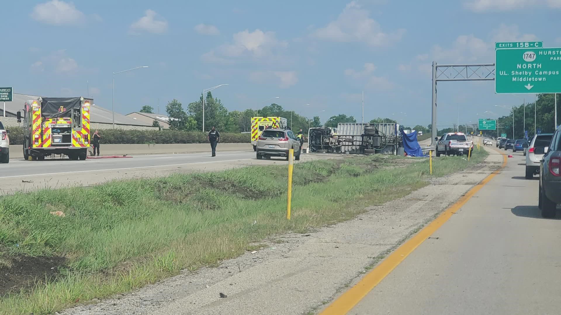 1 dead after box truck rolls over on I-64 East in Louisville