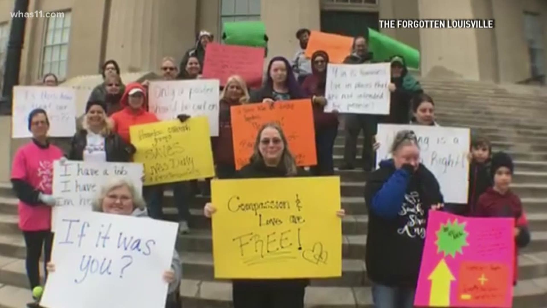 Dozens met outside Metro Hall to show support for the volunteers who continue to help the homeless in Louisville. The volunteers urged people to consider helping local outreach organizations.