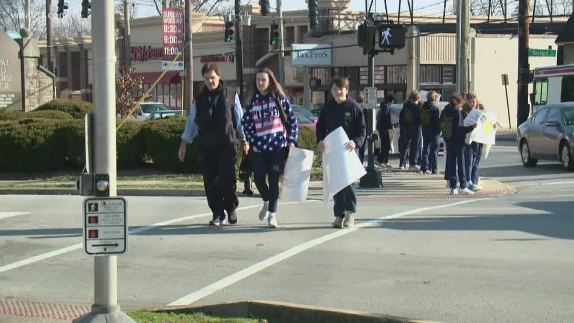 The 8th grade students lined up on Bardstown Road to combat hate. Photojournalist Nick Goldring has the story.