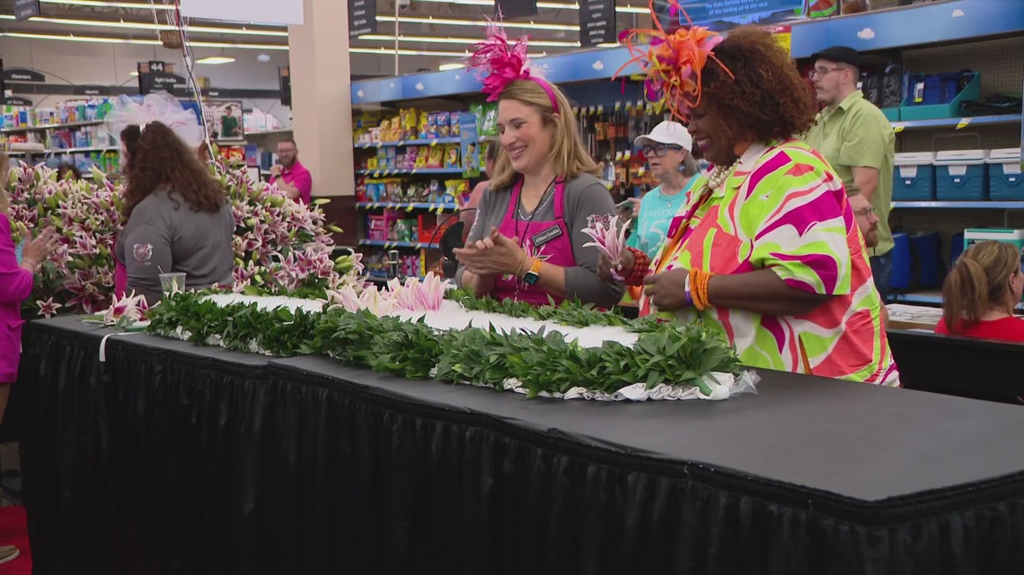 Customers gather around as Kroger florists create Kentucky Oaks lily garland