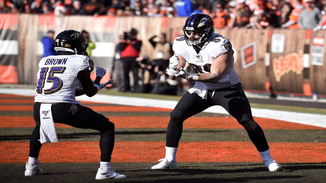 Ravens win 11th straight, clinch top seed in AFC playoffs