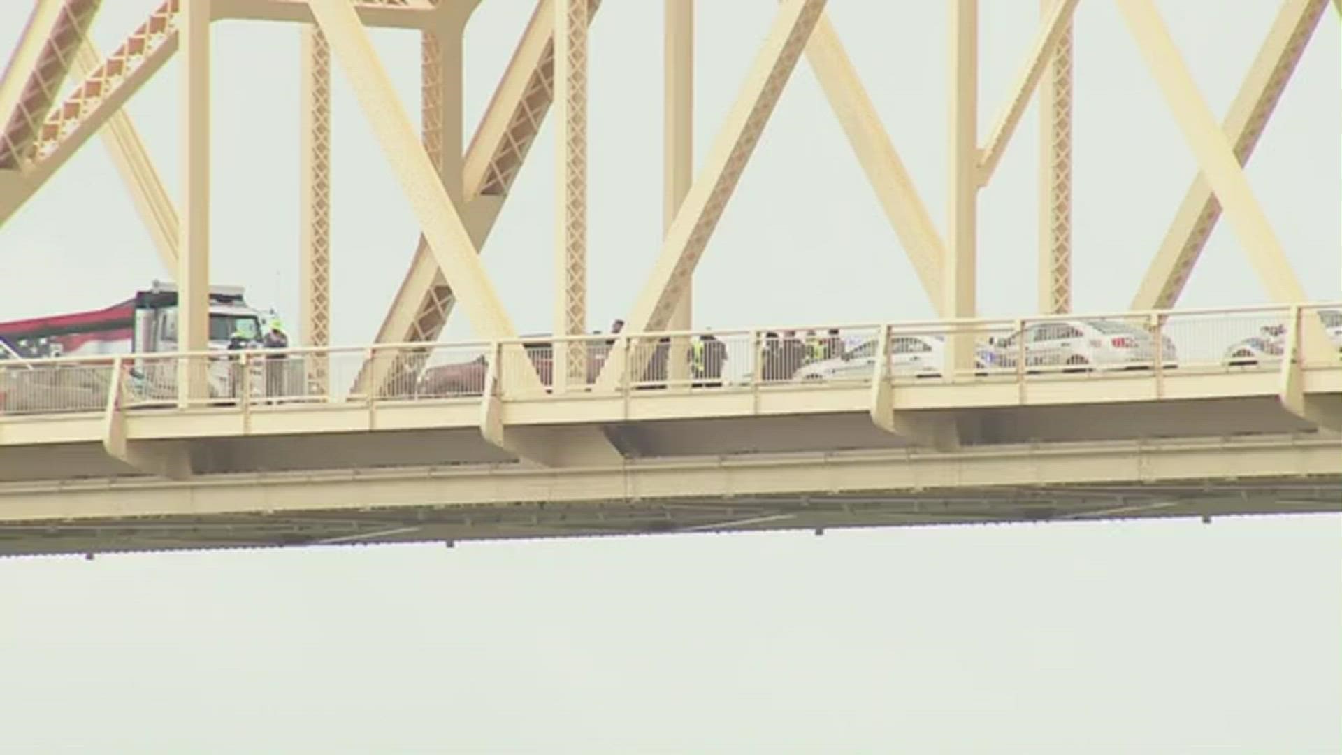 Protesters arrested after shutting down the Clark Memorial Bridge Monday morning, hanging a banner showing Breonna Taylor on the side of the bridge.