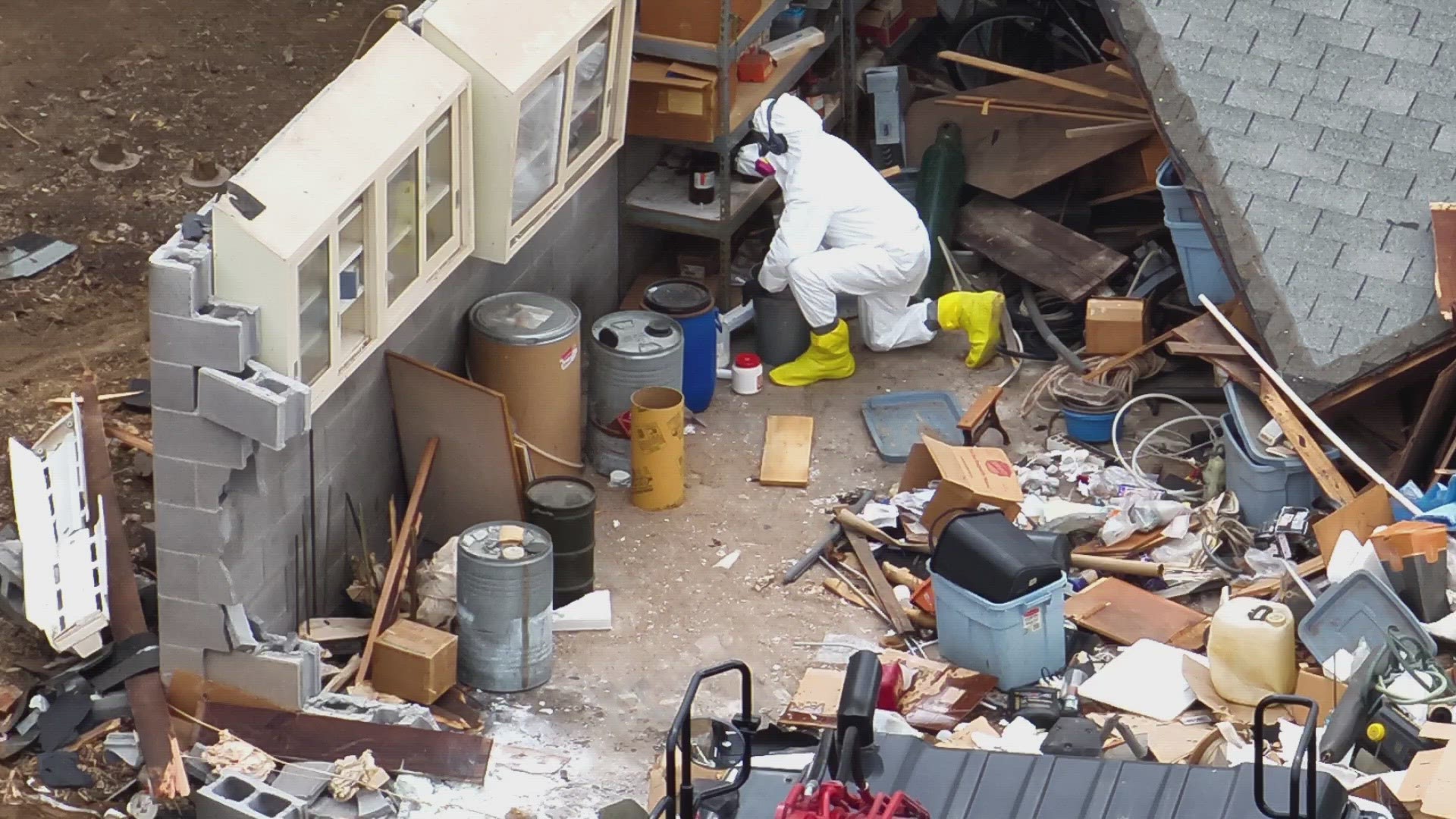 The EPA said the roof and back wall of the house are down and its contents are coming out in two separate waste streams depending on the debris and chemicals.