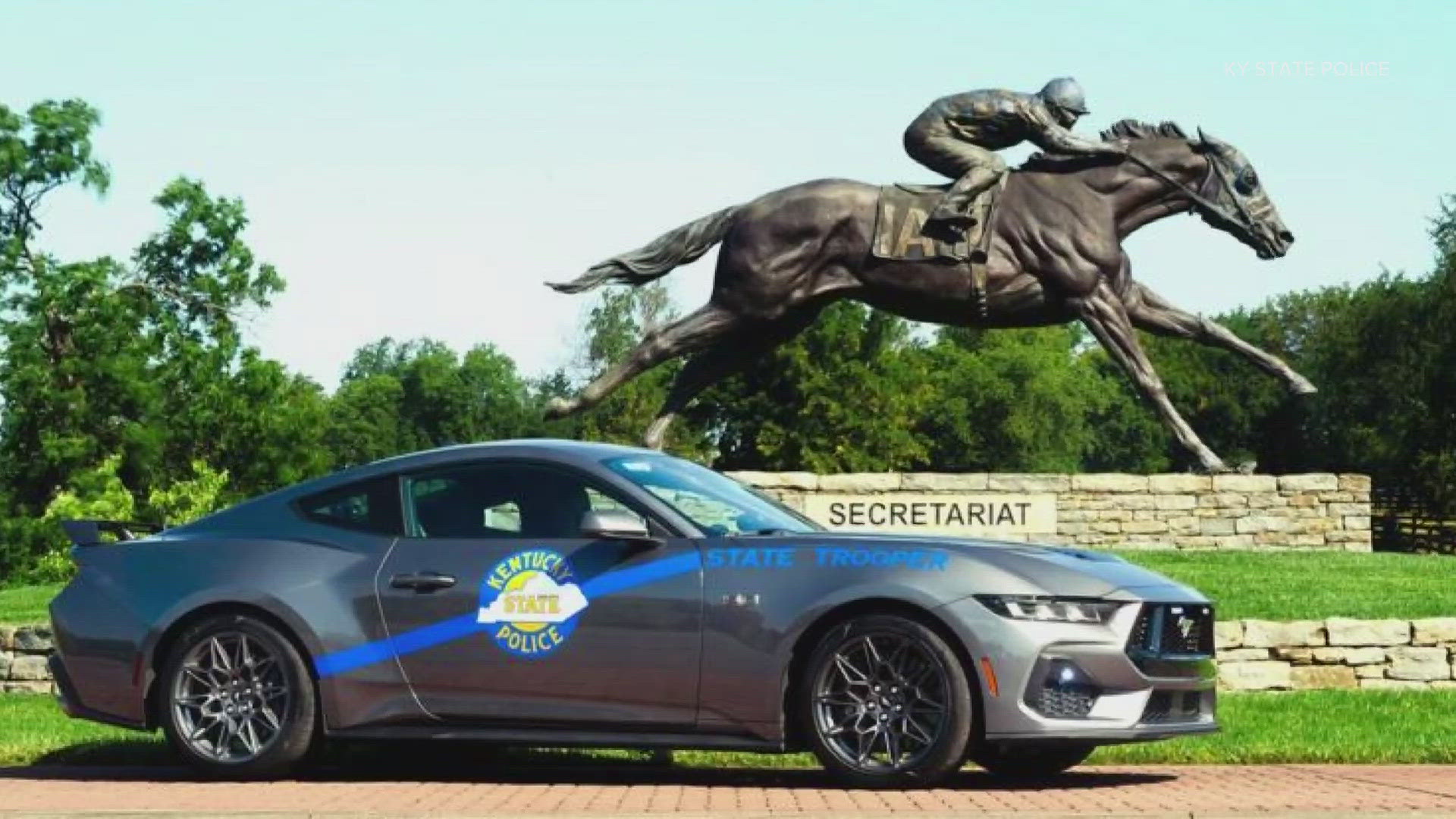 KSP said this year's photo celebrates the state's horse industry and features a 2024 Ford Mustang GT in front of a Secretariat statue.