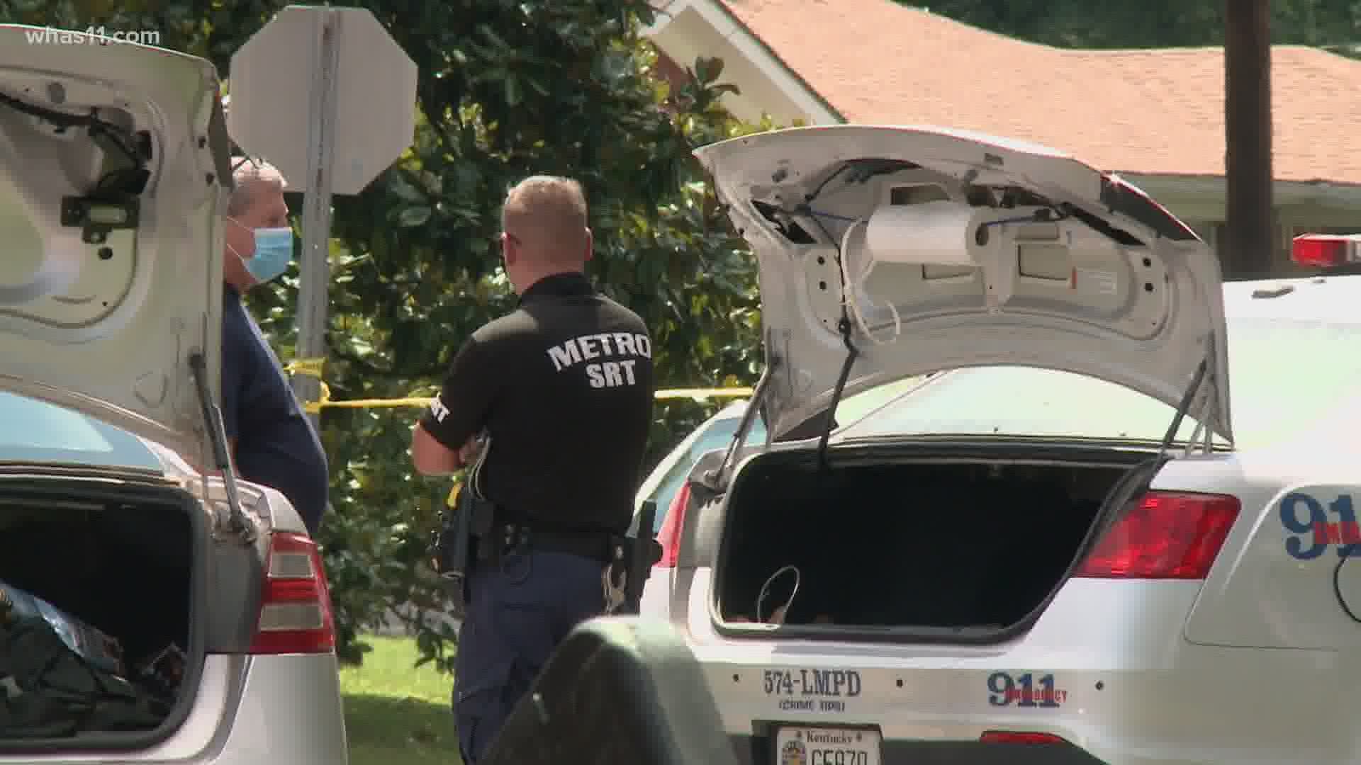 An officer headed to a shooting scene collided with a vehicle on Robinhood Lane in Louisville's Newburg neighborhood on Sunday.