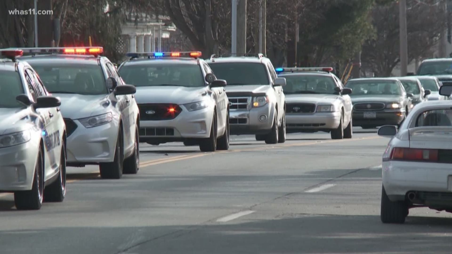 LMPD officers escorted Detective Mengedoht's casket to the funeral home.