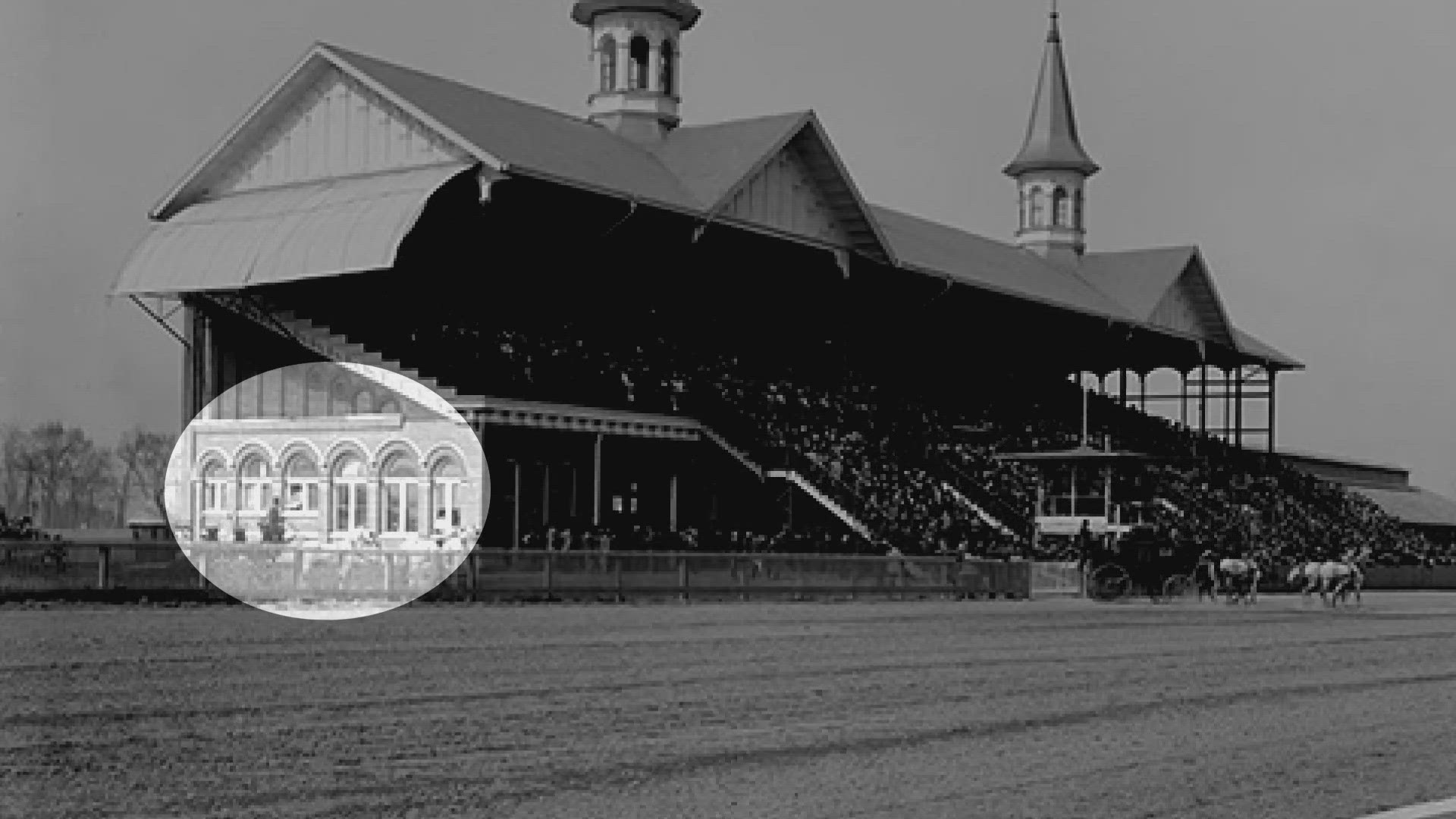 The brick wall with curved arches and port hole windows is part of the original Louisville Jockey Club Grandstand which opened with the Twin Spires in 1895.