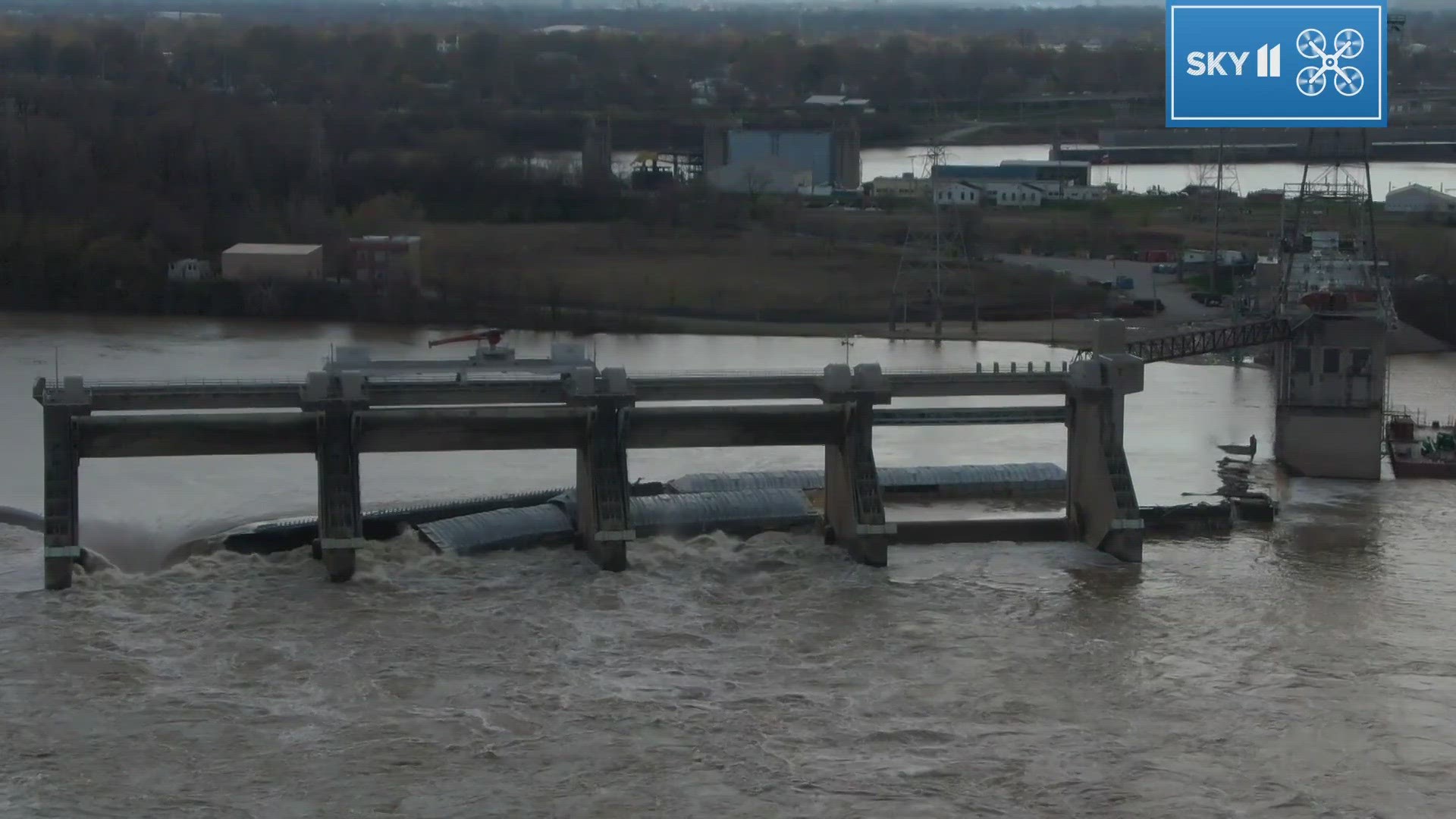 Louisville emergency management says around two this morning, a towboat pushing 11 barges hit a structure near the dam. They broke loose but all are accounted for.