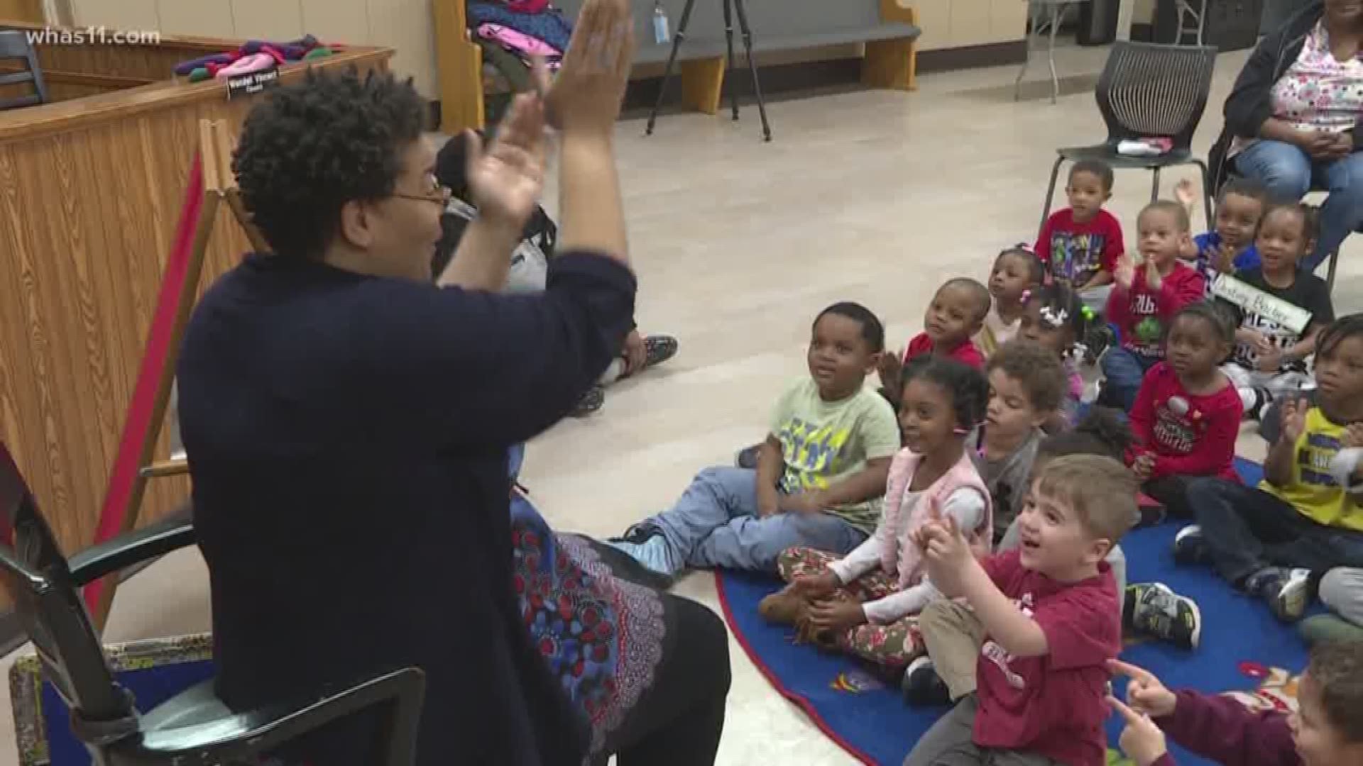 Librarian promoting learning through singing