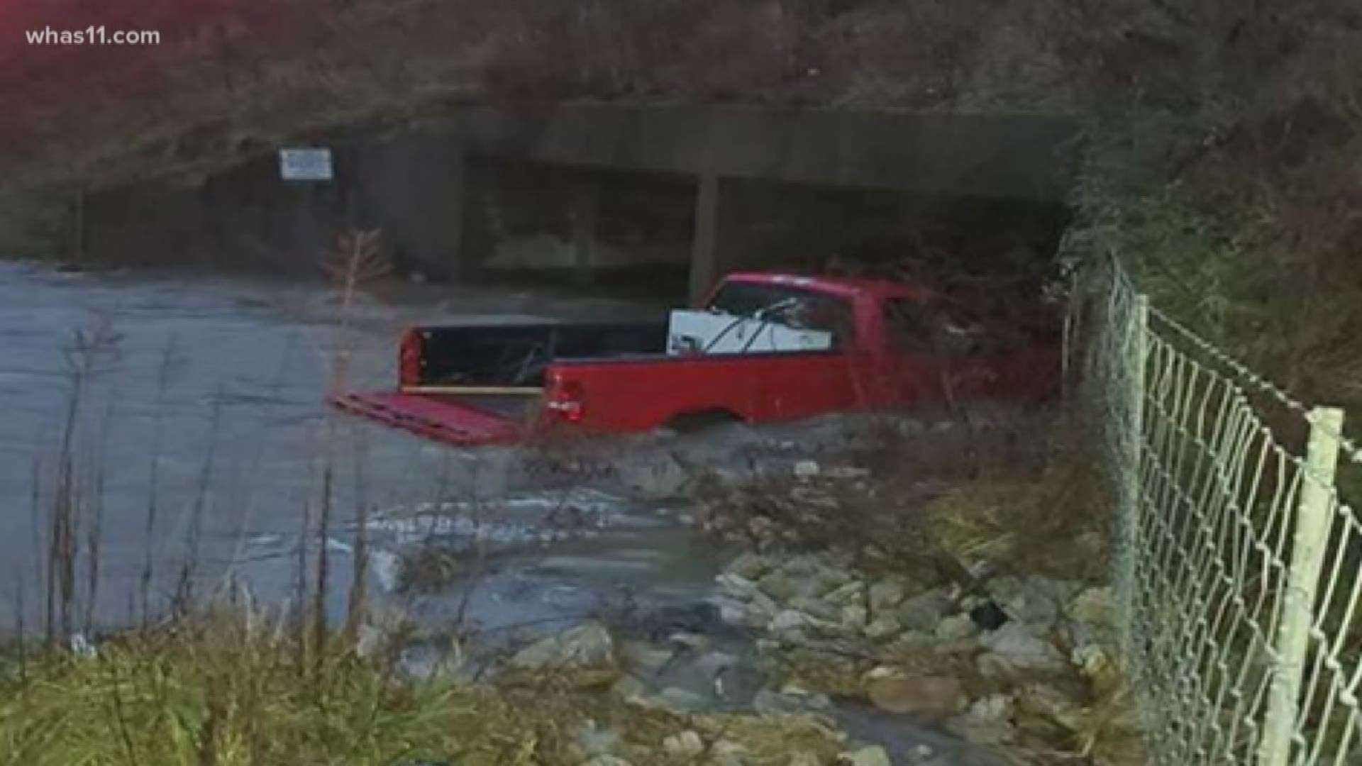 Emergency crews helped rescue a man and three children after their vehicle was swept away by high water in Elizabethtown.