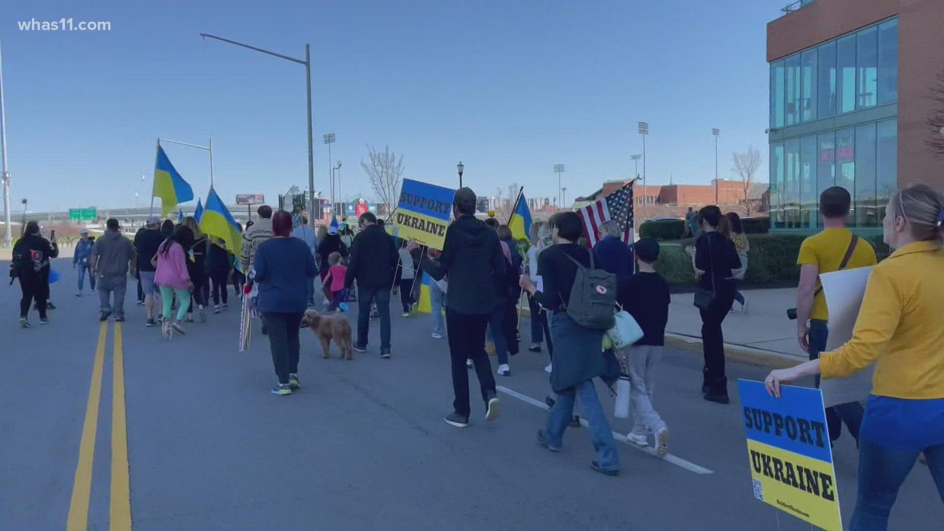 Hundreds gathered Sunday at Waterfront Park in downtown Louisville to rally and march for Ukrainians as the country continues to be attacked.