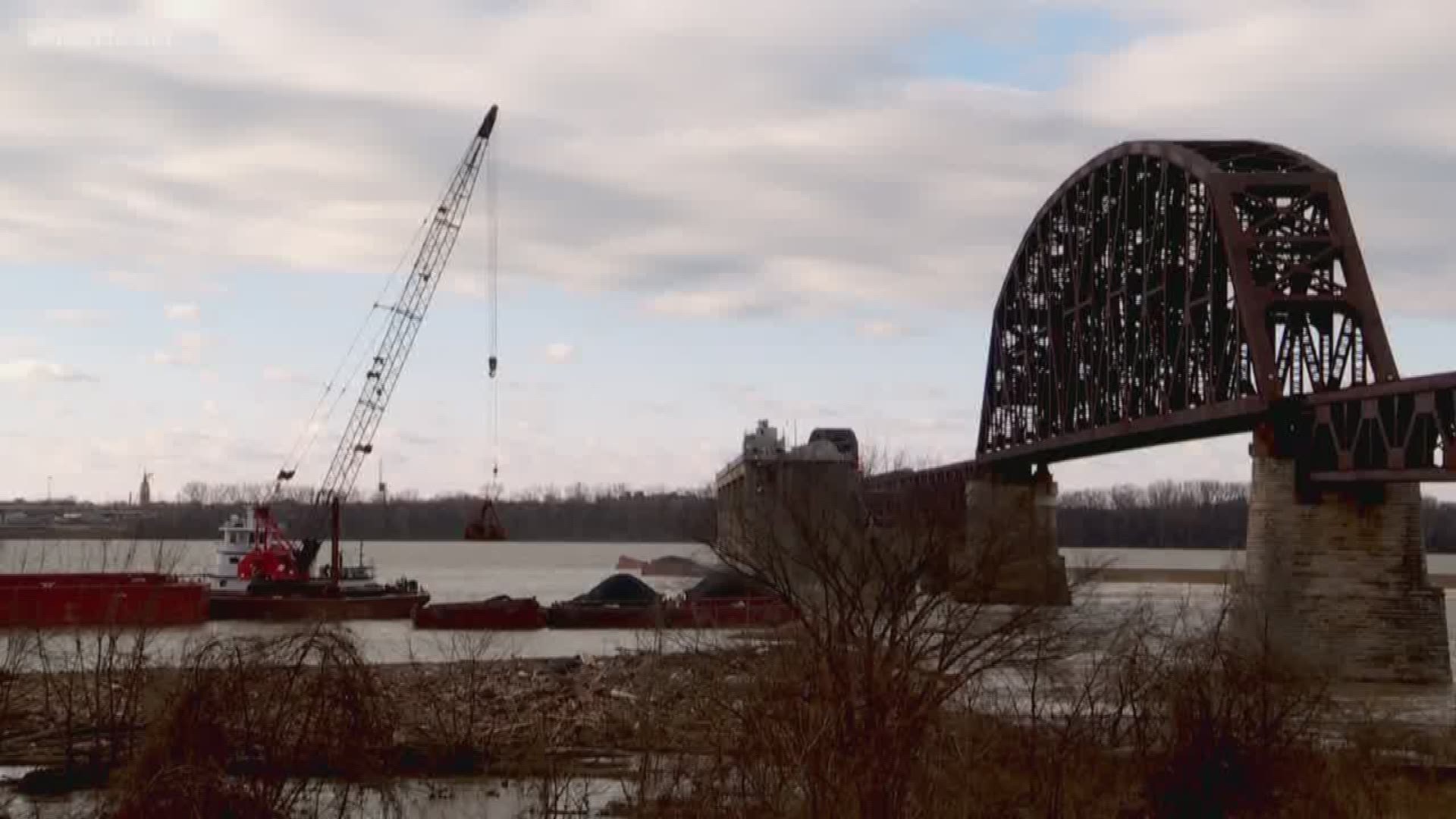 For two weeks several coal barges have been stuck on the Ohio River, near the Falls of the Ohio,after they broke loose from a towing vessel when it crashed into the Clark Memorial Bridge on Christmas Day.
