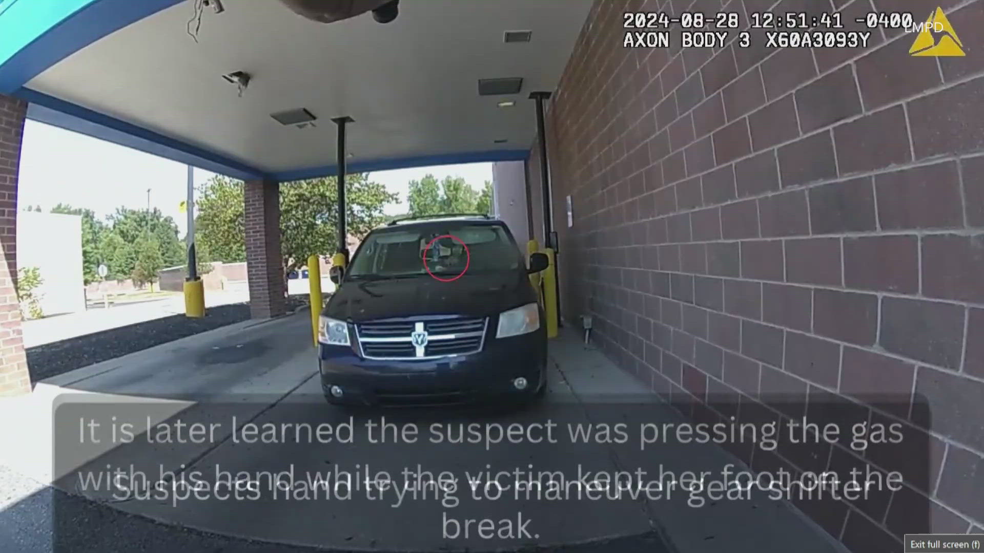 Louisville Metro Police released the body camera video that shows an officer shoot a man through a bystander's car windshield while in a Walmart pharmacy drive-thru.