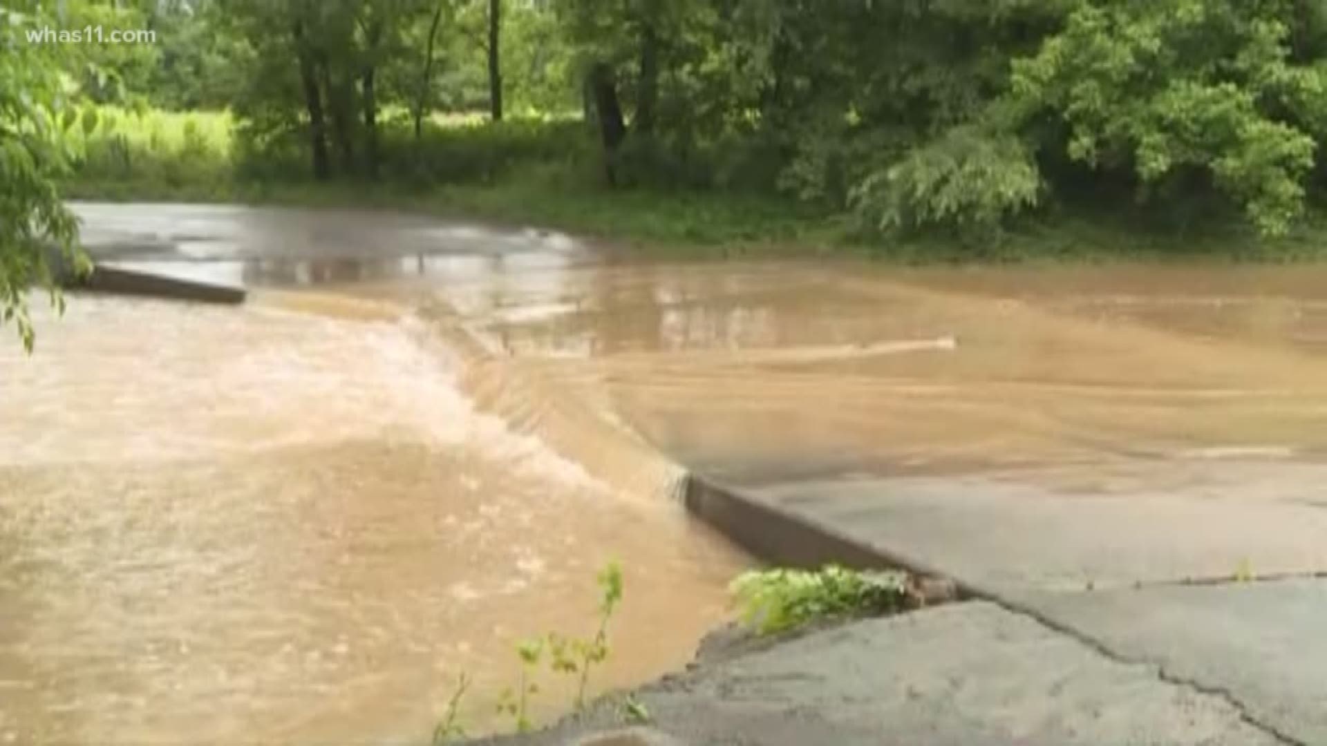 The Spencer County Sheriff's Office said the man, his wife and their two children were driving on Old Heady Road when they tried to cross a bridge covered with water.