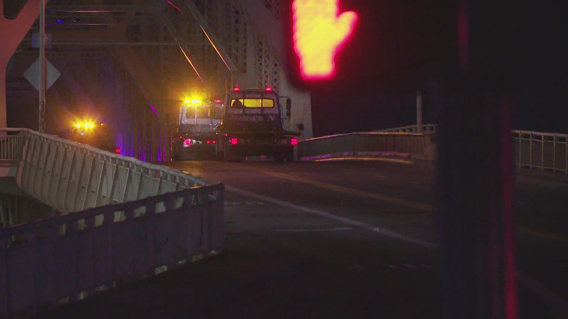 Police say a U-Haul headed northbound on the bridge lost control, going into the southbound lane and crashing into another vehicle Saturday night.