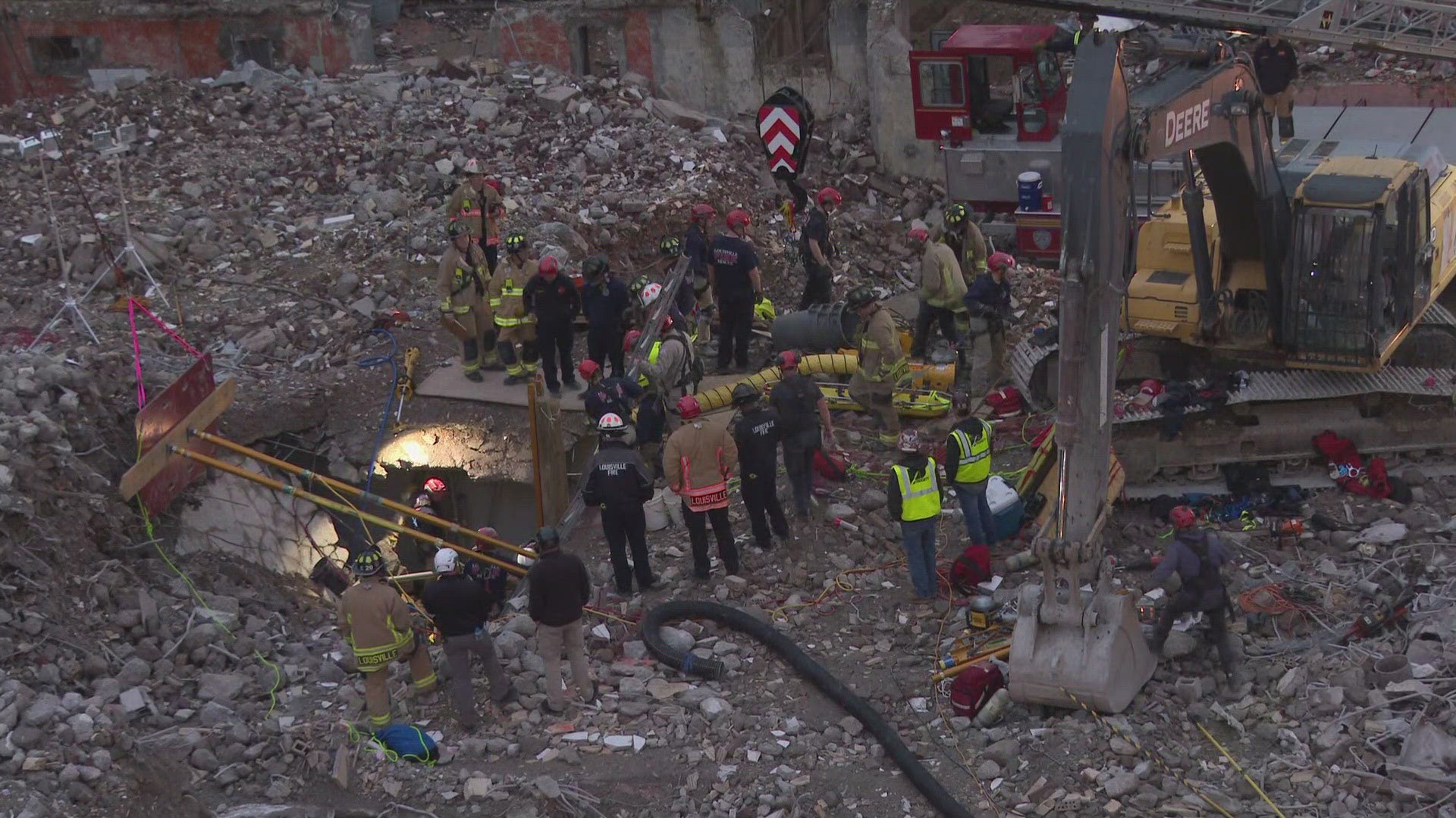 A man trapped in the rubble of a collapsed construction demolition site is still speaking with first responders.