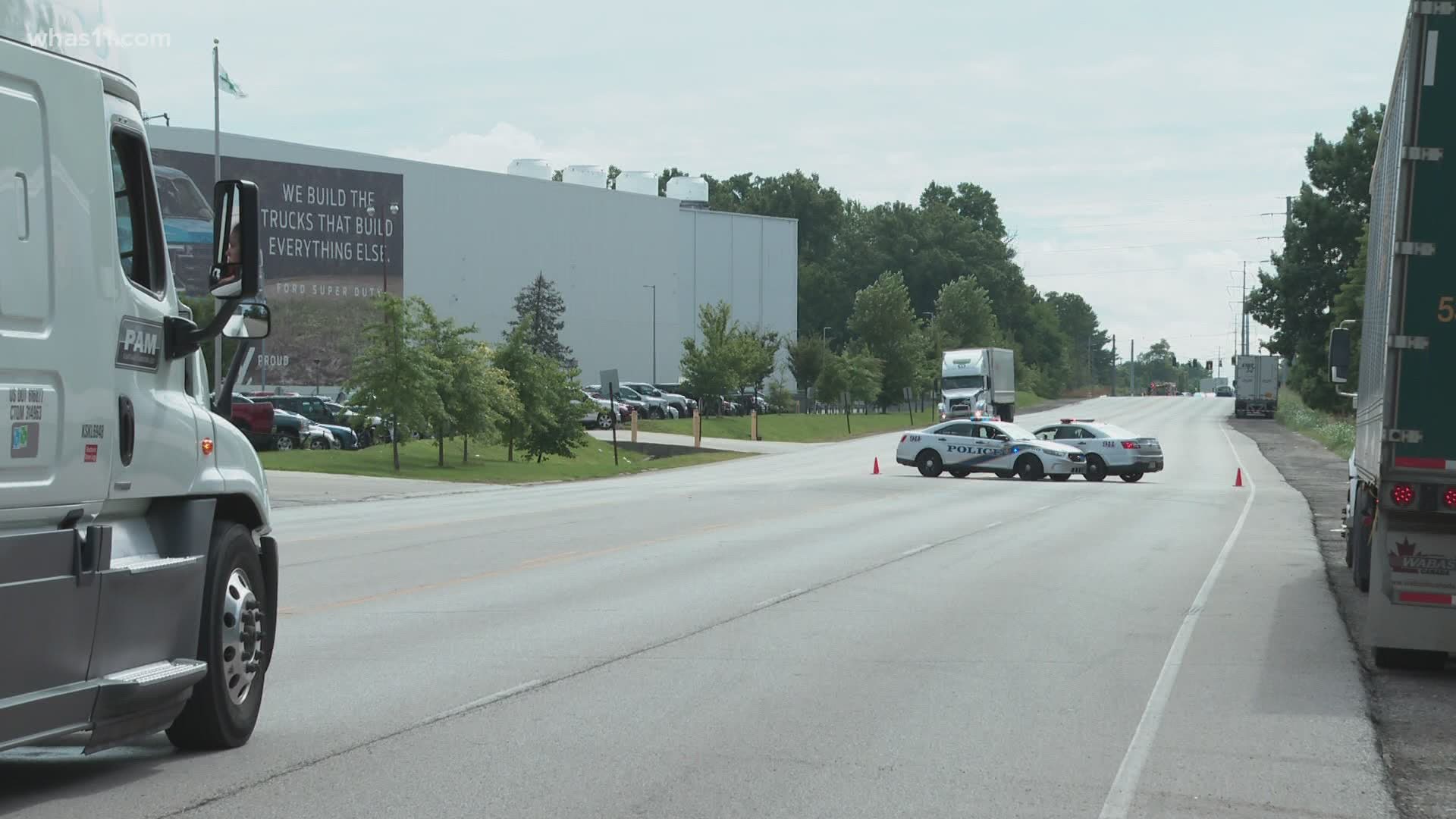 LMPD says a semi-tractor trailer hit a northbound driving vehicle as it was turning left into the Ford Truck Plant.