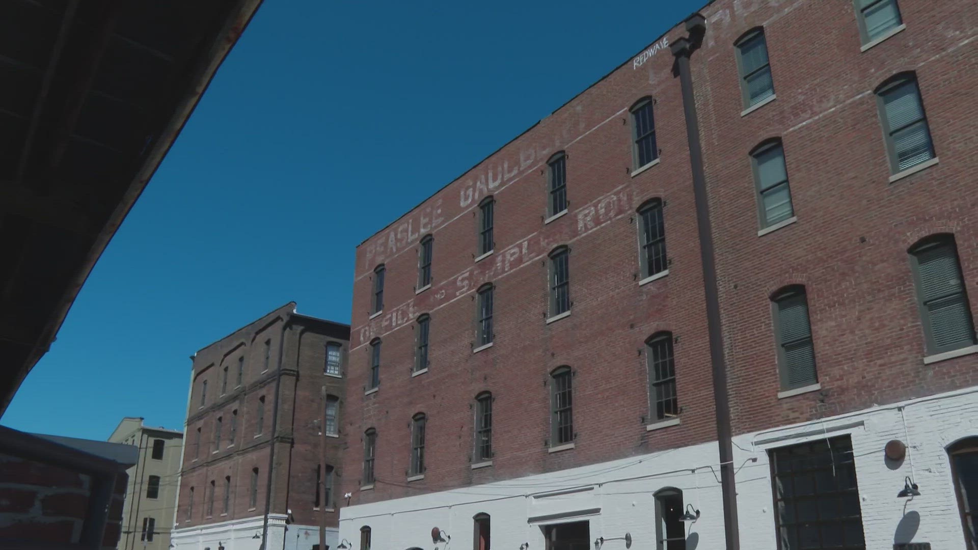 Developers celebrated making use of old buildings for new housing. The Painter's Row apartment complex opened in Portland on Tuesday.